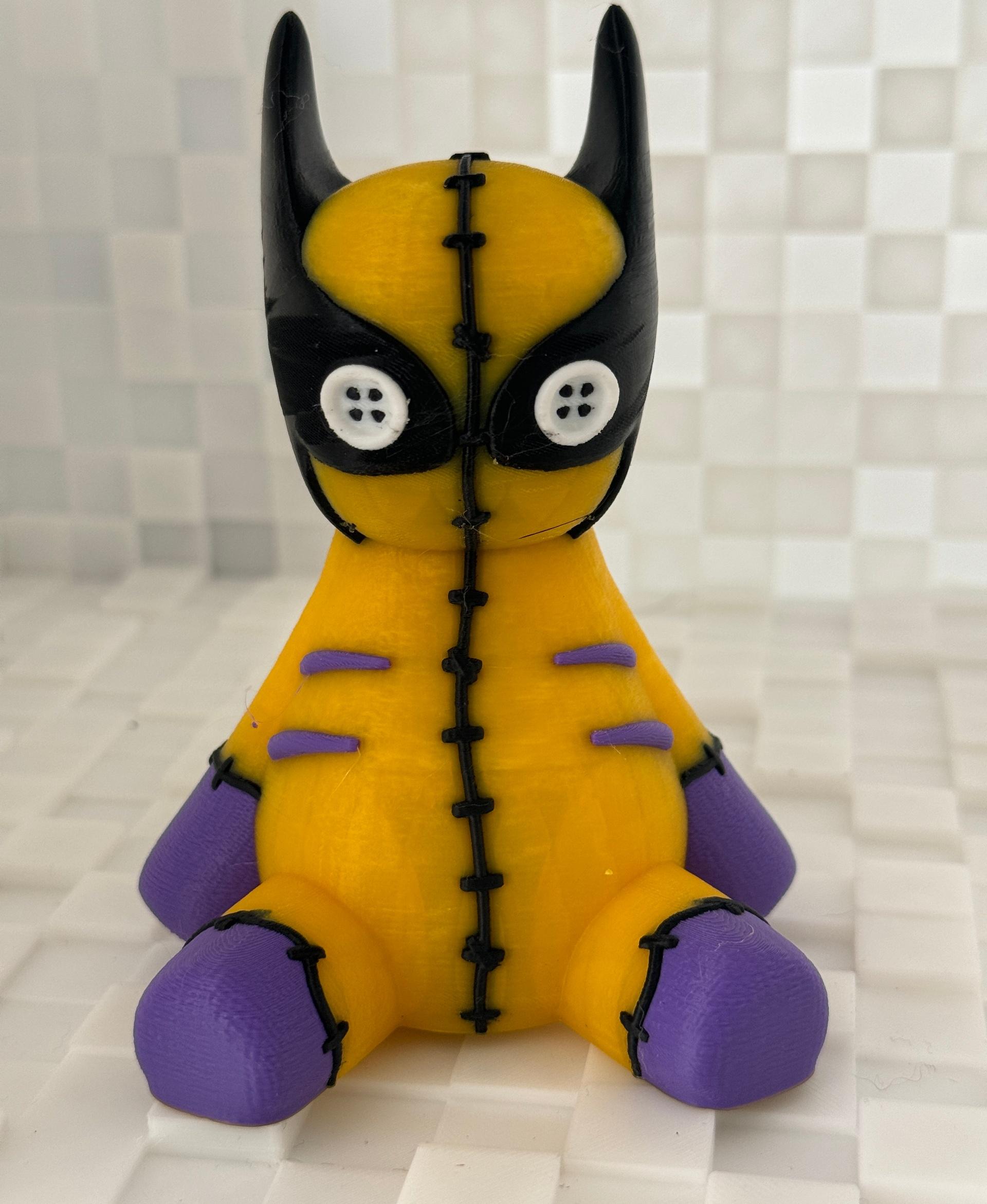 Wolverine Voodoo - Printed on the Bambu Lab A1 Mini in Polymaker Polylite Yellow PLA, Duramic Purple PLA, and Elegoo Black and White PLA, this little guy took 3 days, 1 hour and 49 minutes to finish, but he was worth it.

So fun and cute!  - 3d model