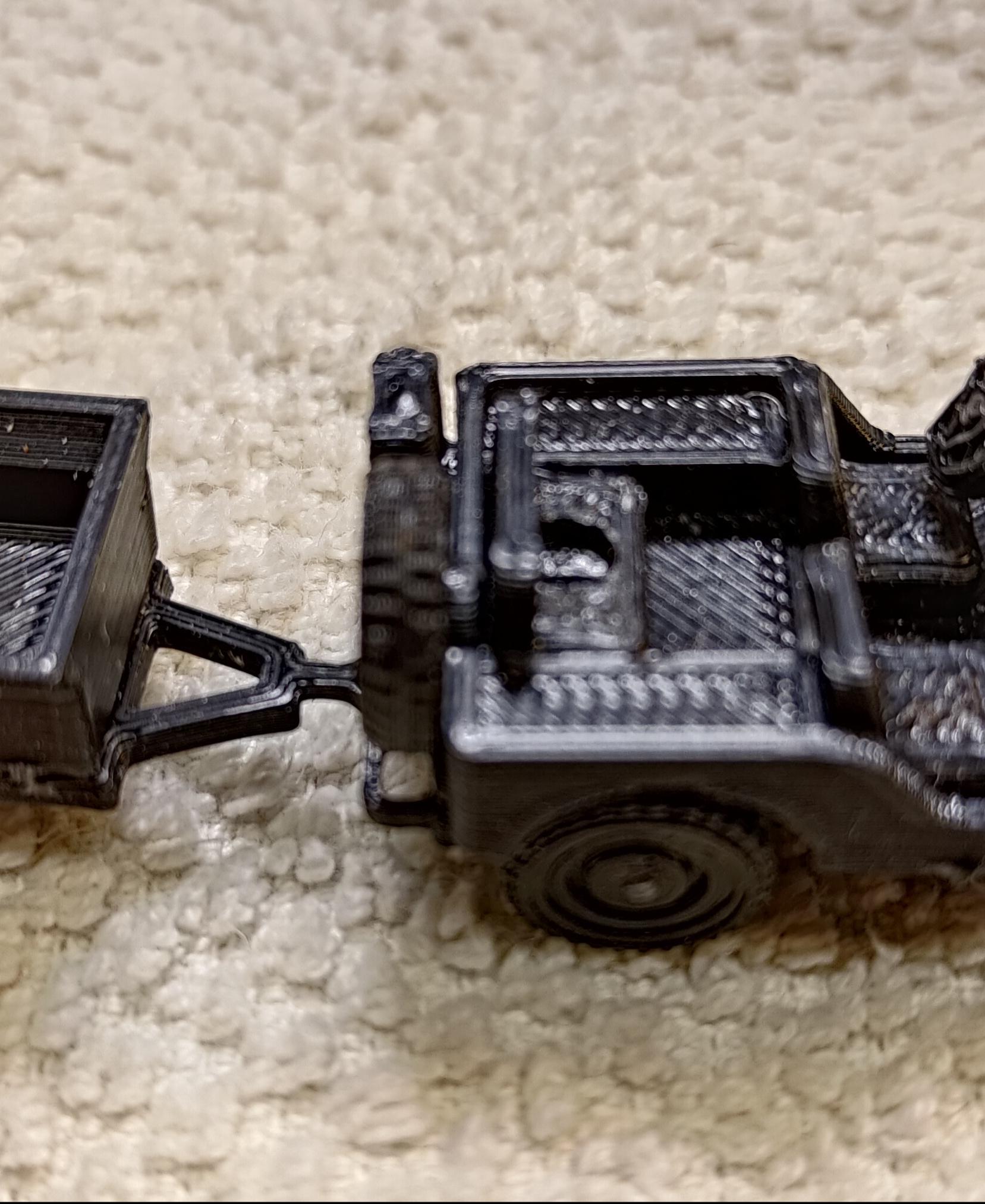Jeep Kit Card - Awesome build.  A bit small scale for my big old fingers but got through it.  Had one part left over - viewed build video but didn't see it.  The designer is a genius to get it all to print flat with no supports. - 3d model