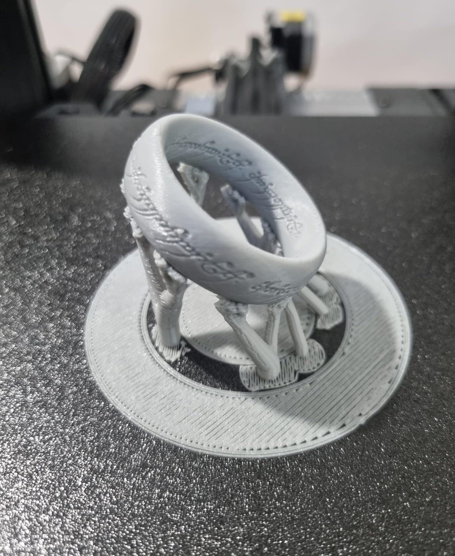 The One ring organice support - Great design, beautifully made. For some reason when I tried to print it at 0.1 layer height, it failed twice (the supports got all mashed up) but first go at 0.2, and it worked perfectly. I'll put on my 0.2 nozzle and try again. This was printed at 50% size (for lack of filament). - 3d model