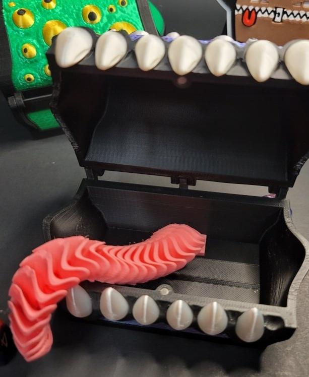 Googly-eyed mimic box with flexible Tongue 3d model
