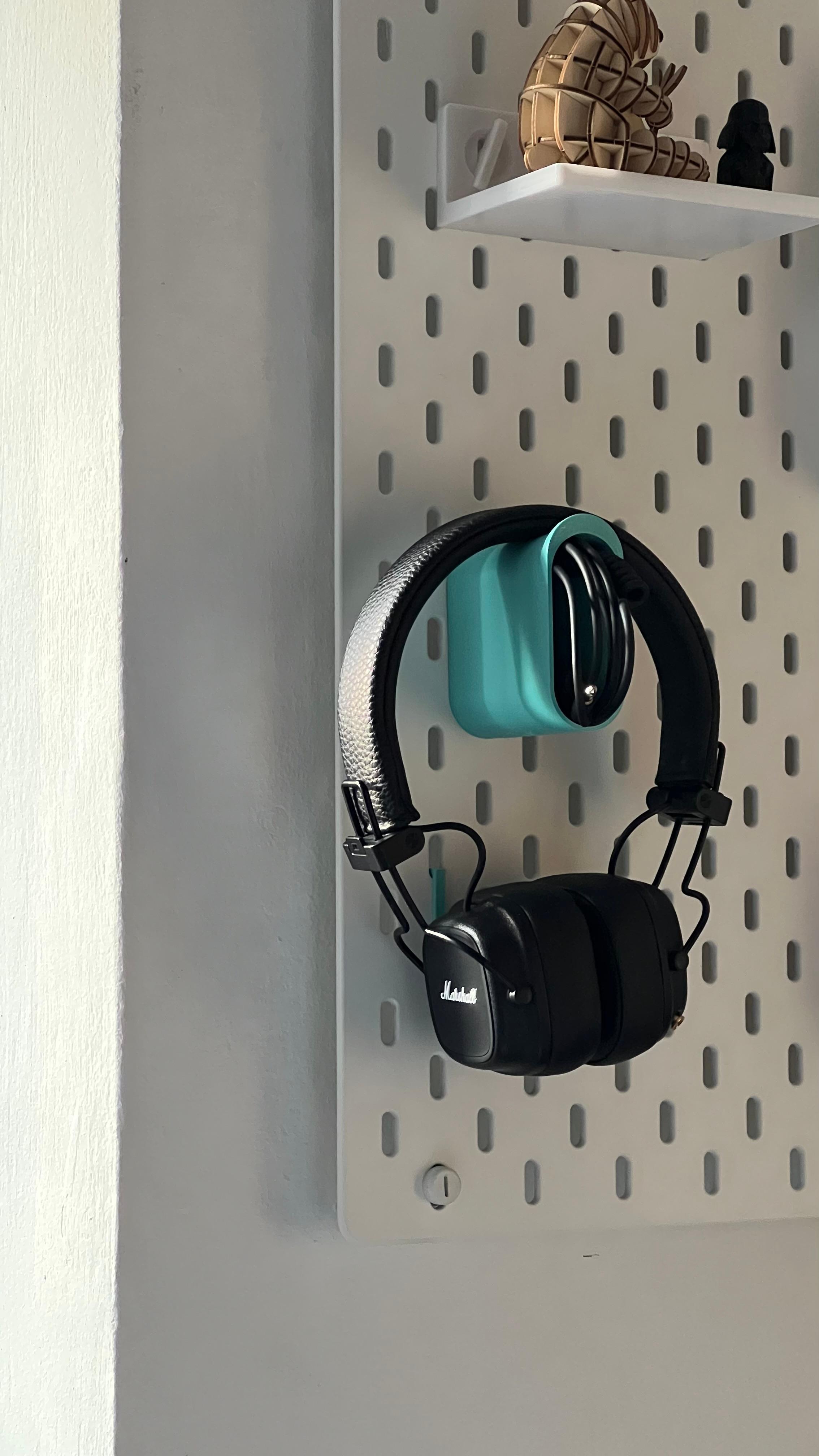 Headphones holder with cable storage 3d model