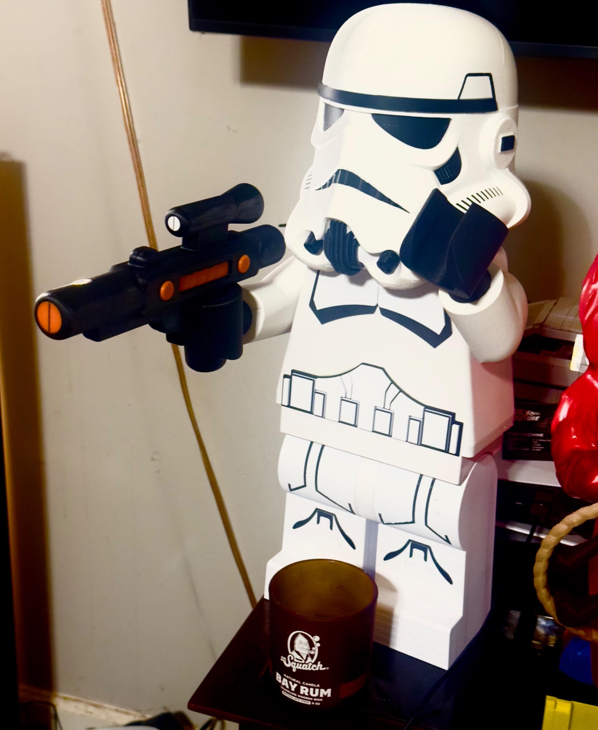 1100% Lego Stormtrooper - I made a blaster for him. Working on fixing it so it fits his hands better. I will upload a pic of the fix in a few days - 3d model
