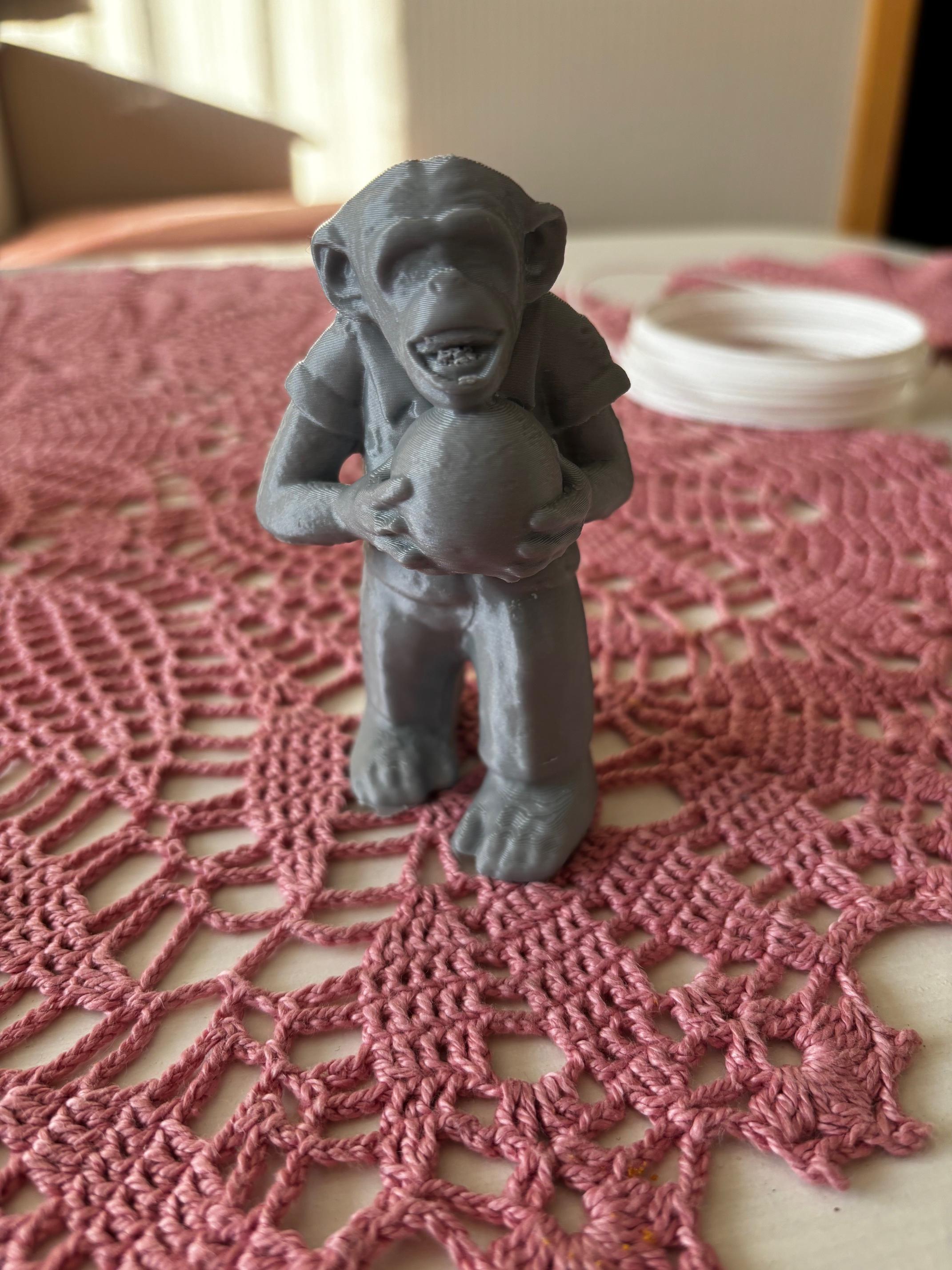 Monkey holding a bowling bowl sculpture 3d model