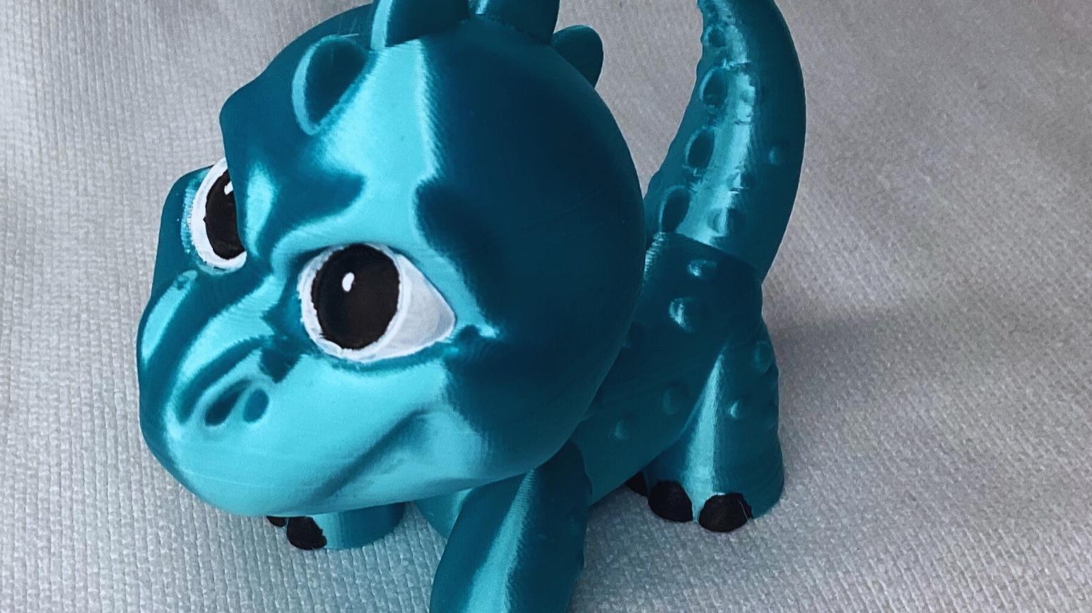 Dino Pup - Printed with  polymaker poly lite silk light blue. Hand painted the eyes and toes - 3d model