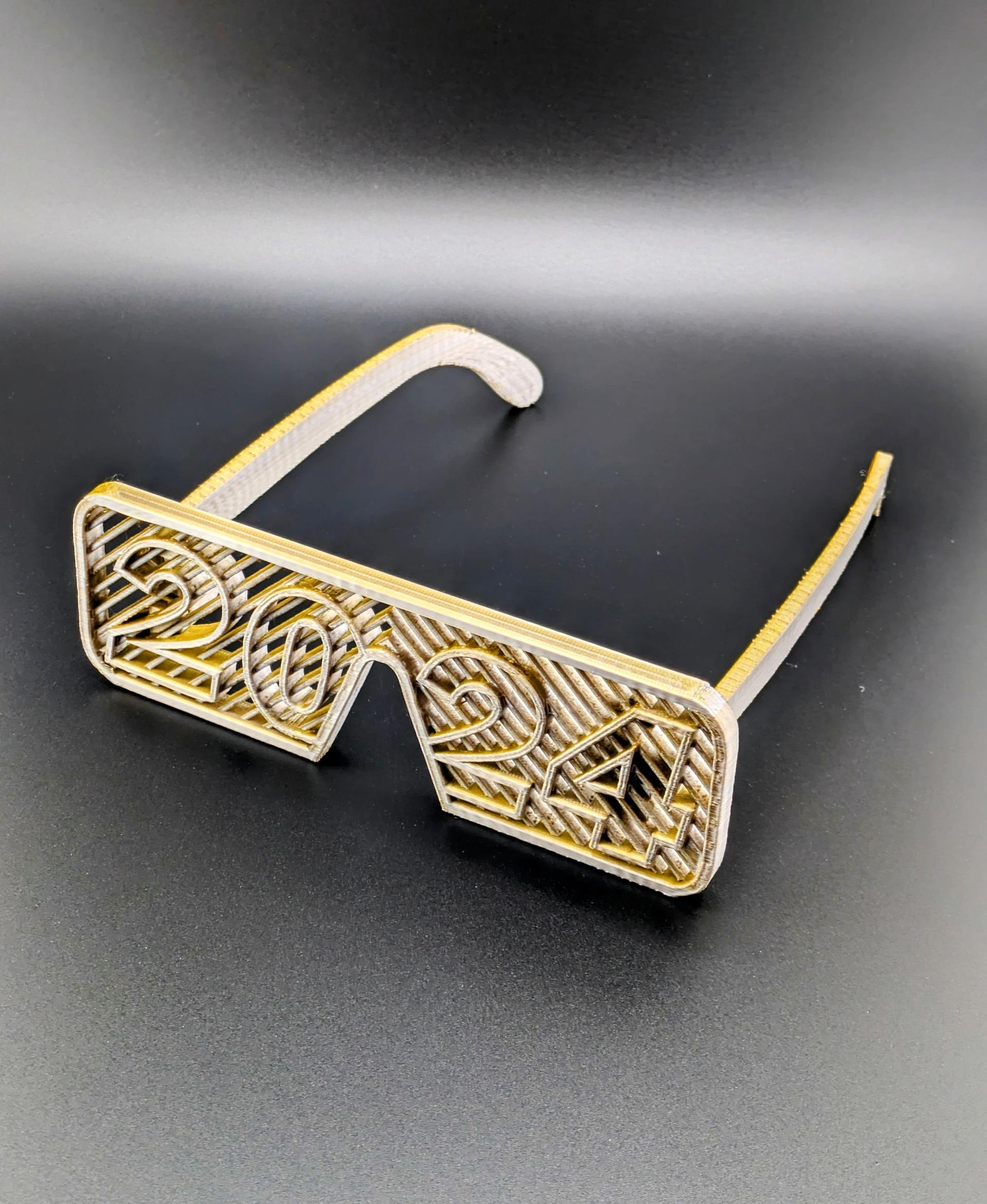 2024 Glasses - 2024 Glasses printed in Silver Gold MatterHackers Quantum PLA 

(Printed On Ankermake M5C at .16mm layerheight) - 3d model