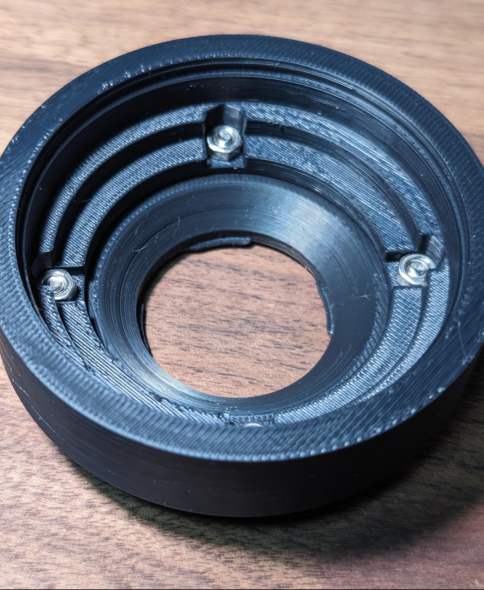 Insta360 Ace Pro Lens Mounting Plate - Mounting plate with an example lens mount attached via the 52mm spaced m3 countersunk bolt holes. - 3d model