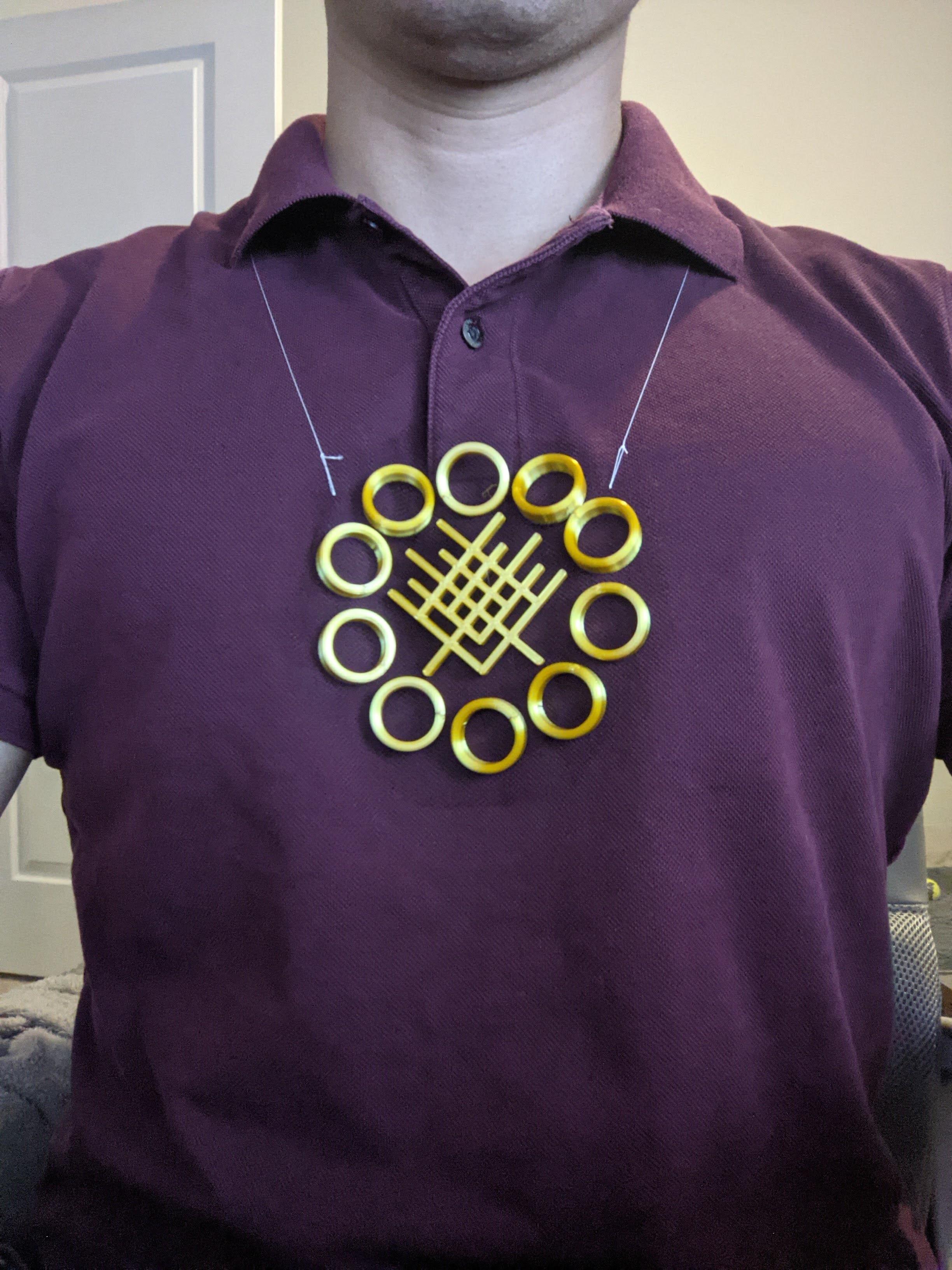 Floating Ten Rings Necklace (3D print on fabric) - The floating ten rings on a necklace - with Shang Chi's super suit flourish in the center. 

The Tulle fabric really hides well! - 3d model