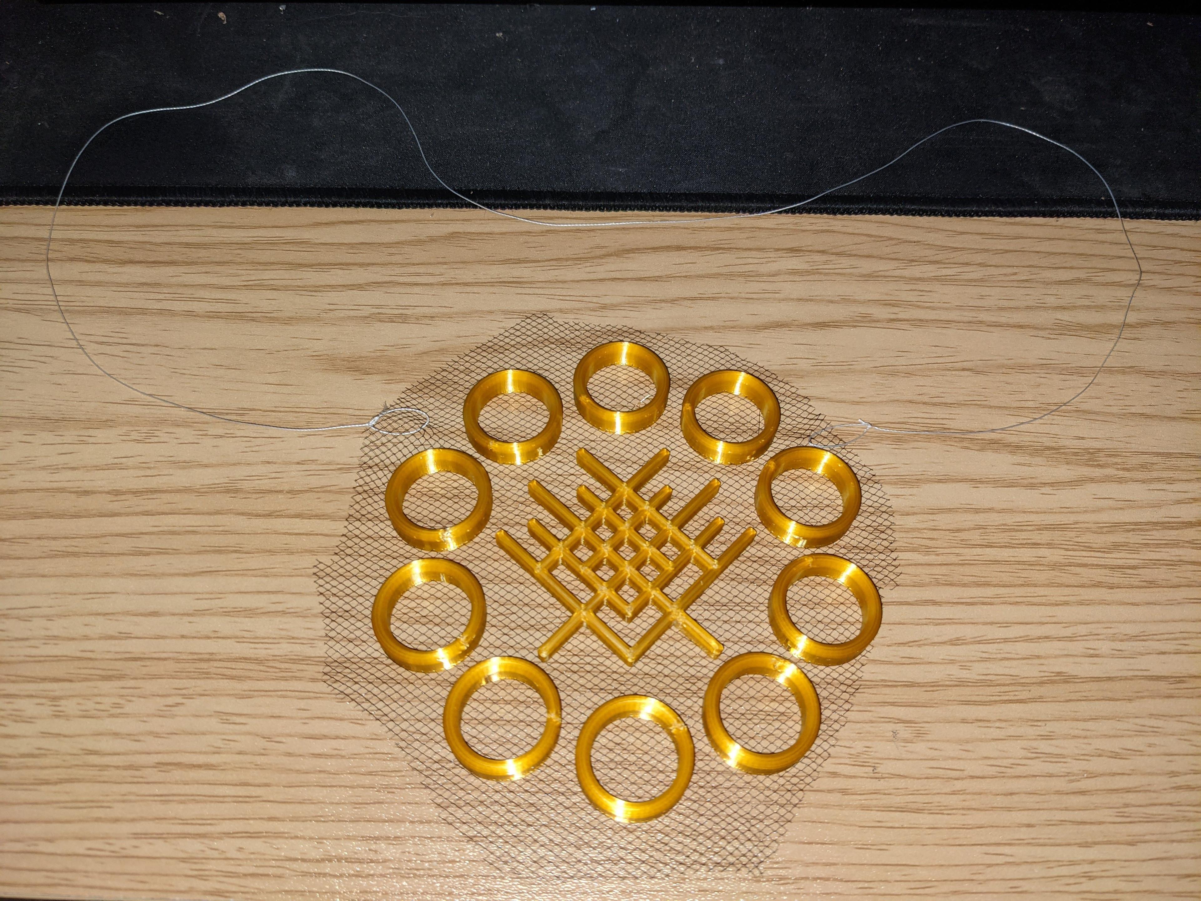 Floating Ten Rings Necklace (3D print on fabric) - how the necklace looks when taken off! - 3d model