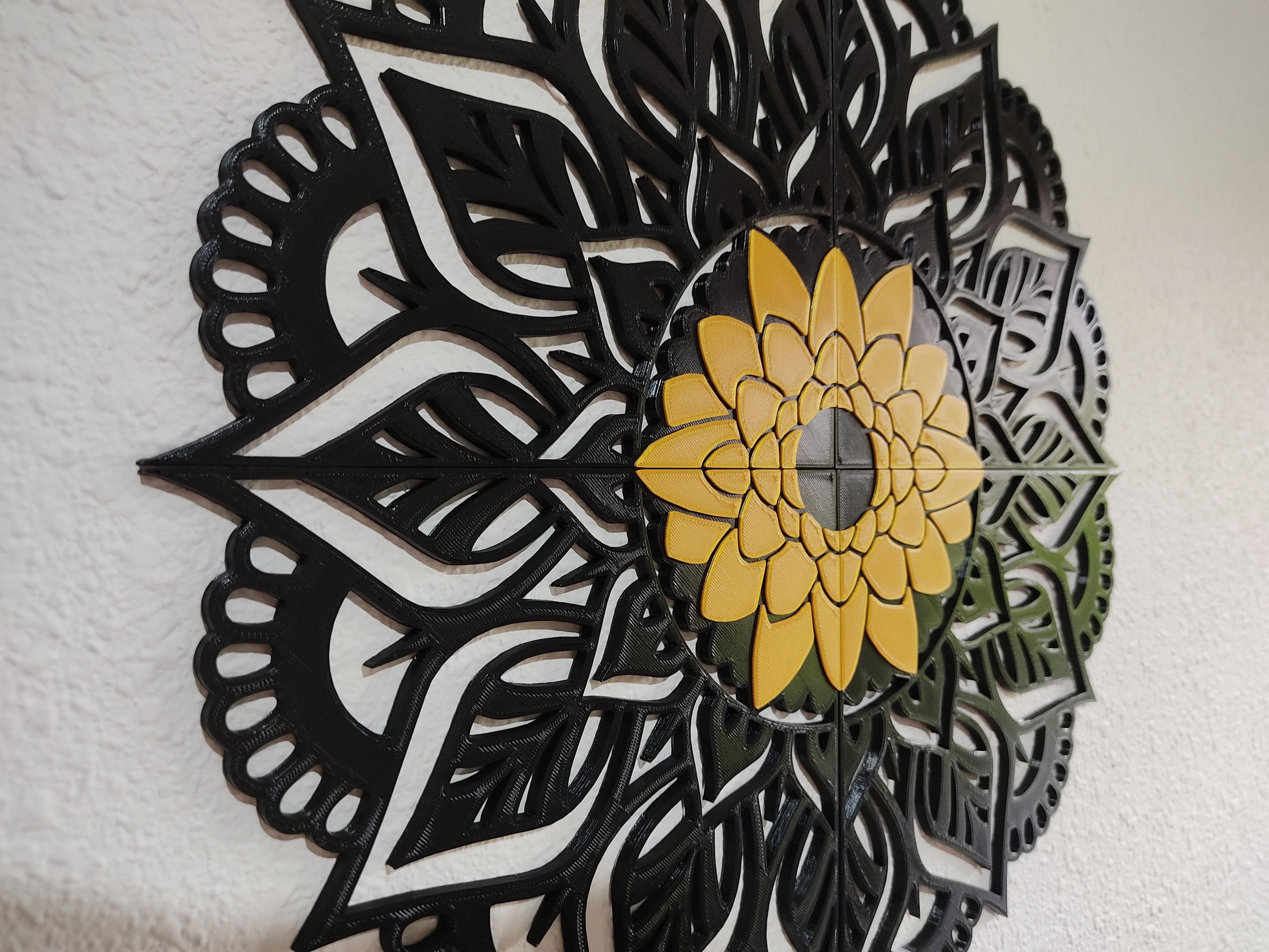 A 4 -piece mandala with a flower in the center. 3d model