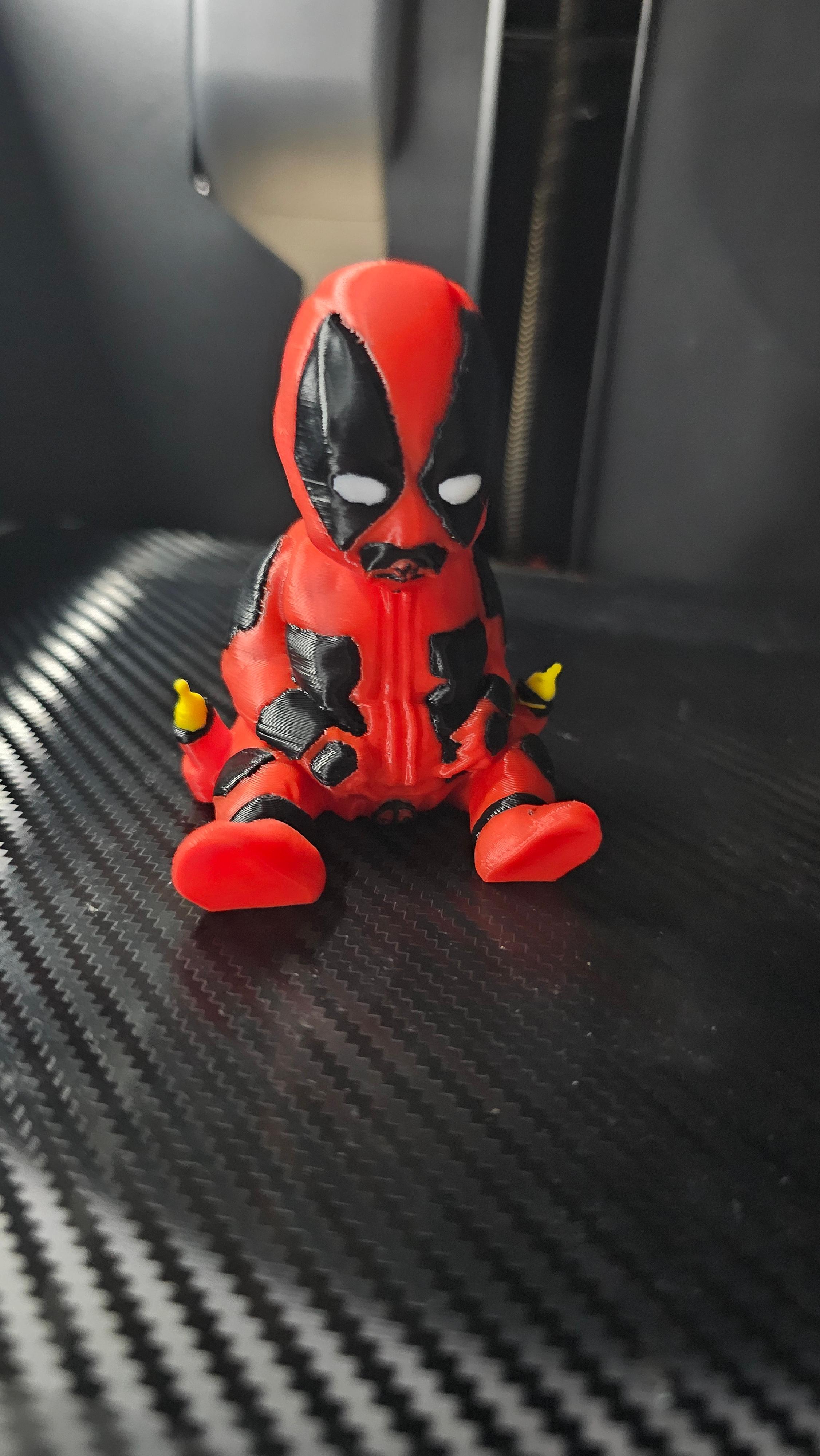 Baby Deadpool 3D Print File | Multicolor 3D (SUPPORTLESS) - 🎨 Just finished printing this multicolored Baby Deadpool, and I’m loving how vibrant he turned out! The details really pop with this color scheme. 🖤❤️ Another fun addition to the collection!  - 3d model