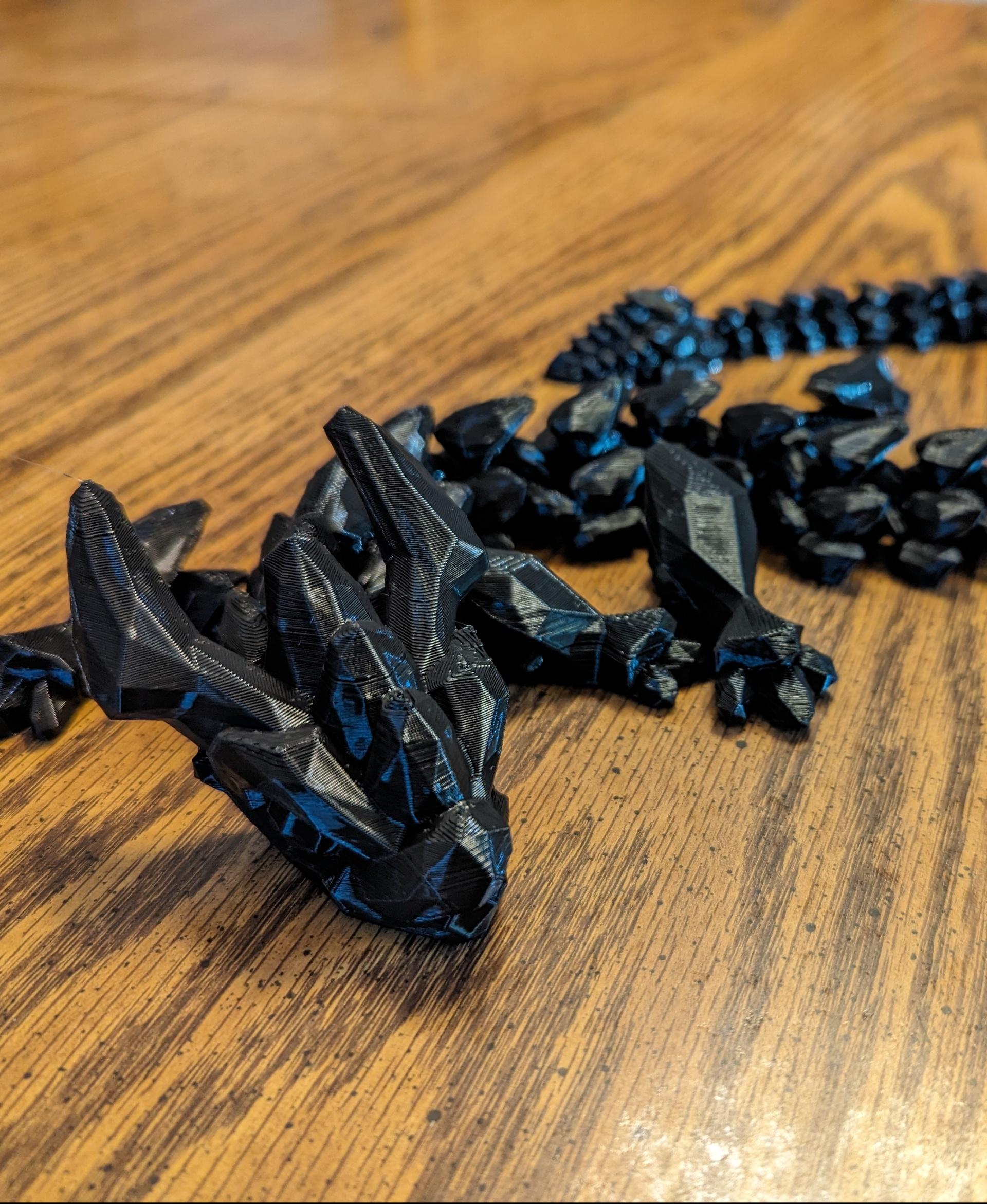 Filamentius Mesh Mayhem Dragon.stl - Printed great and worked loose easily.  Impressive to hold. - 3d model
