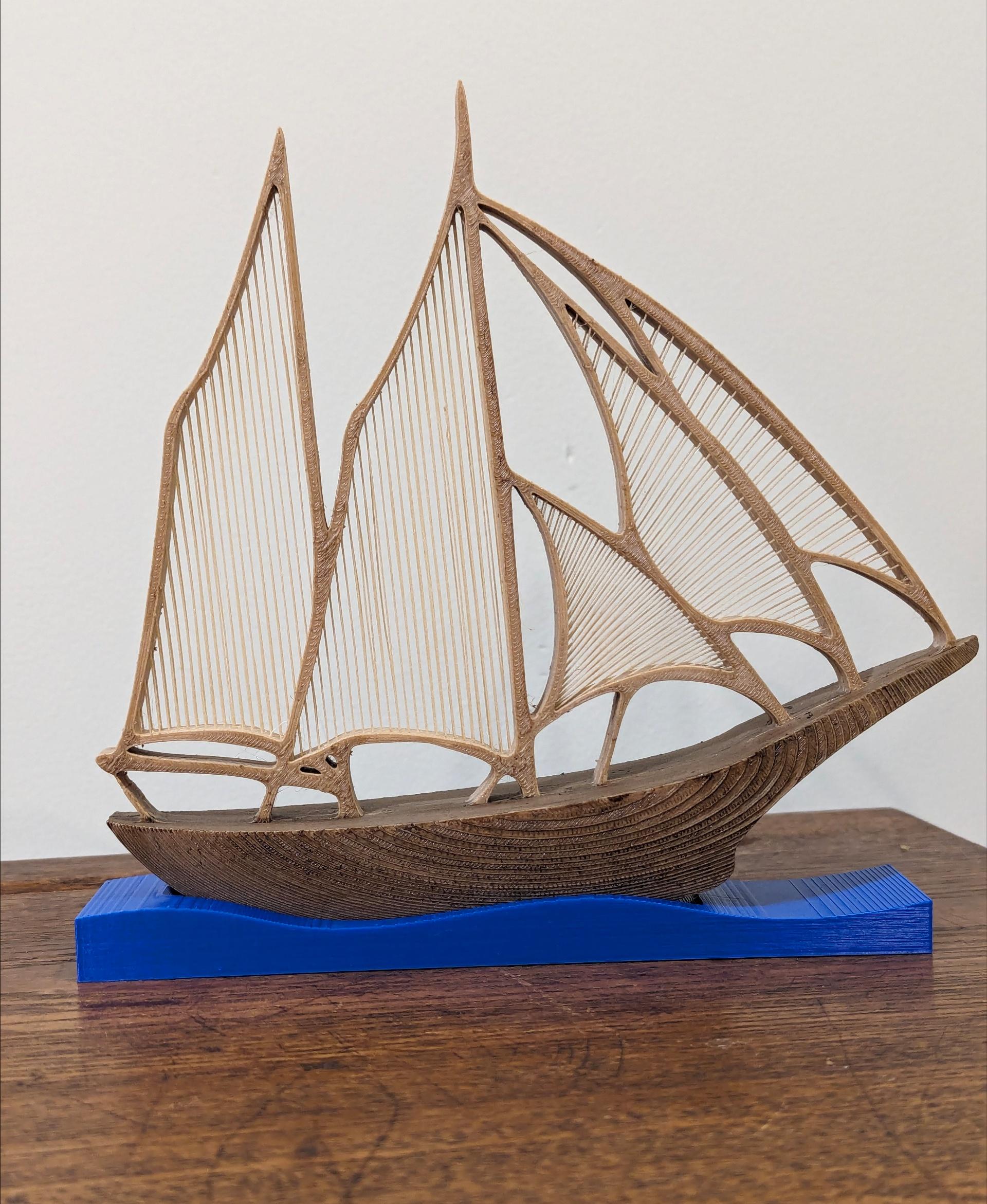 String Schooner Model - Printed on the Prusa MK3.5 in Sliceworx Wood PLA stained with Minwax Golden Oak and Mission Oak.  The stand is in Sliceworx Royal Blue. - 3d model