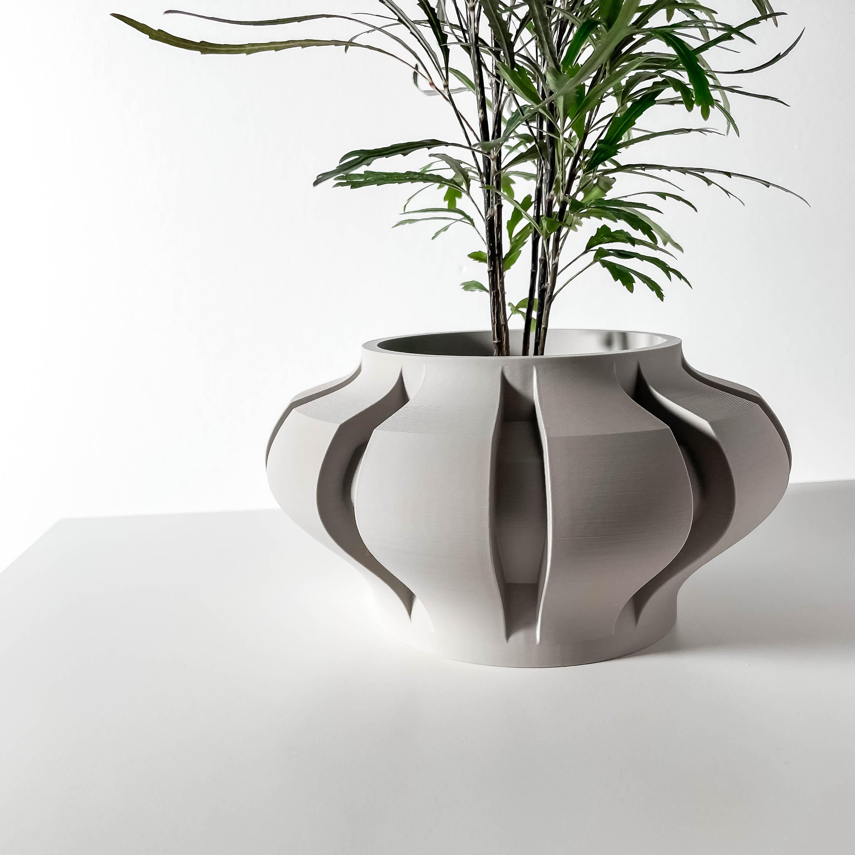The Ariko Planter Pot with Drainage Tray & Stand Included: Modern and Unique Home Decor for Plants a 3d model