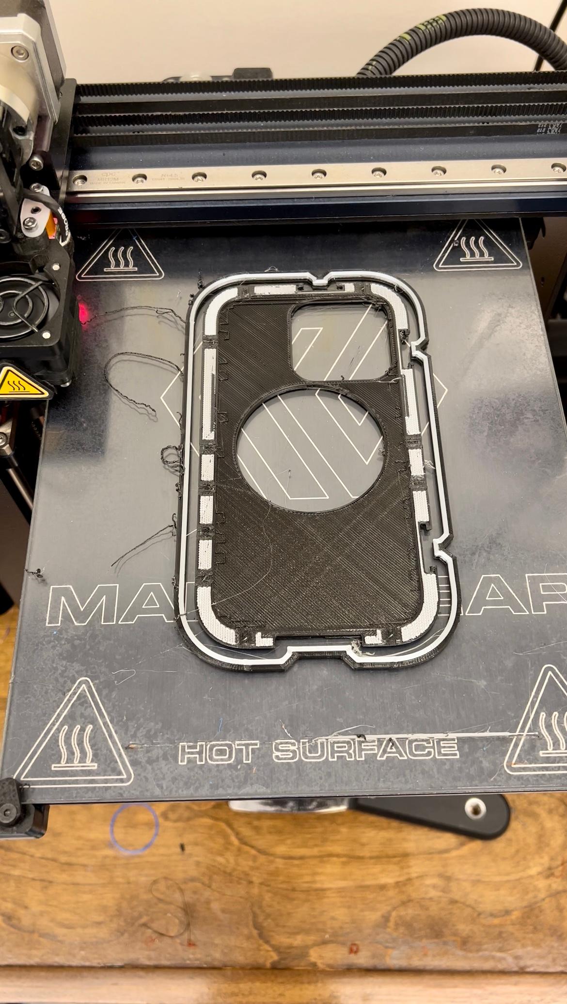 Cinematic Case for iPhone 13 Pro - Here you can see the flexible TPU (Black) on the perimeter and back of the case and the rigid PLA embedded in the sides. - 3d model