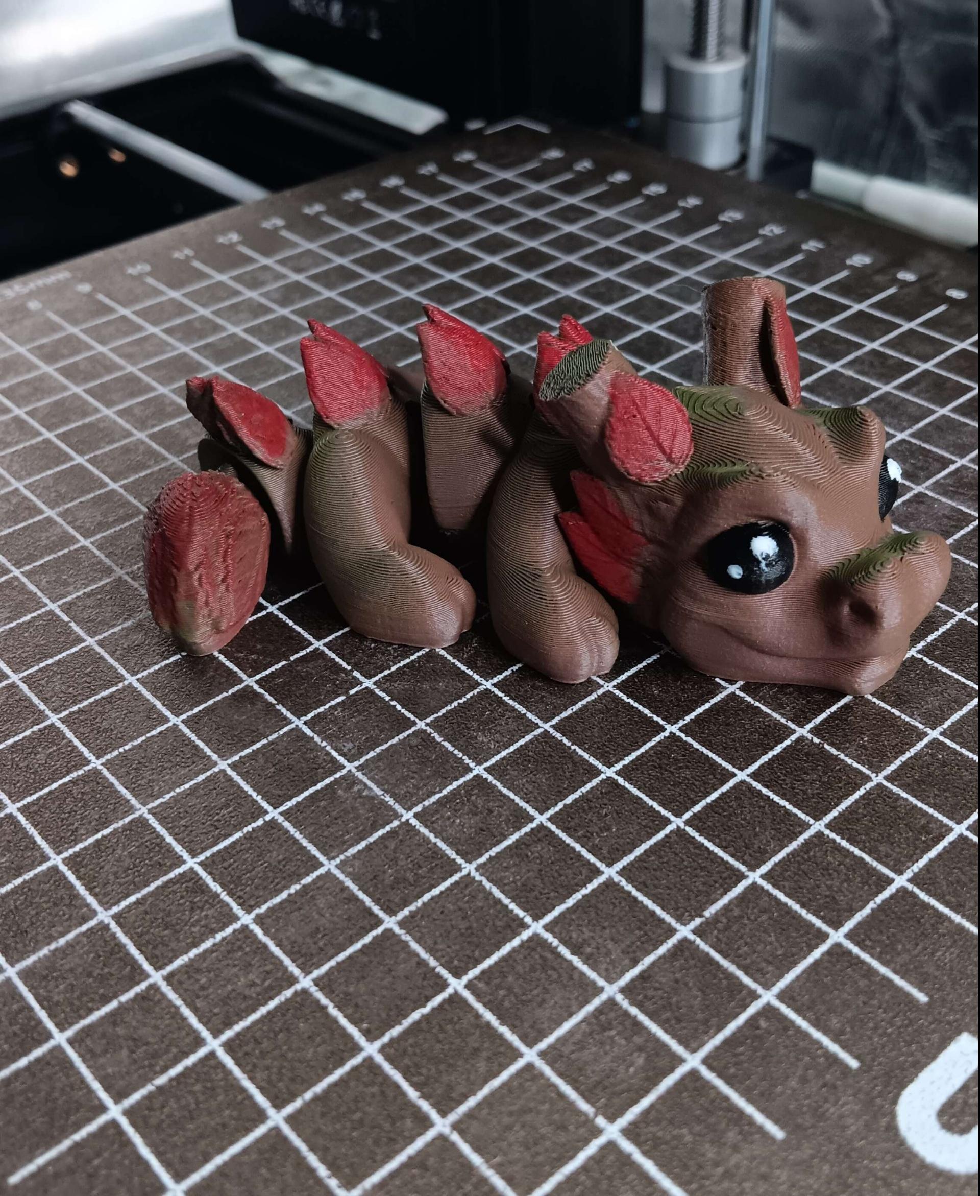 Sprout, Baby Wood Dragon  - Printed in Polymaker's Camo Brown and Green. I did my best to add some red for like a Autumn Theme. He's still a cutie. - 3d model