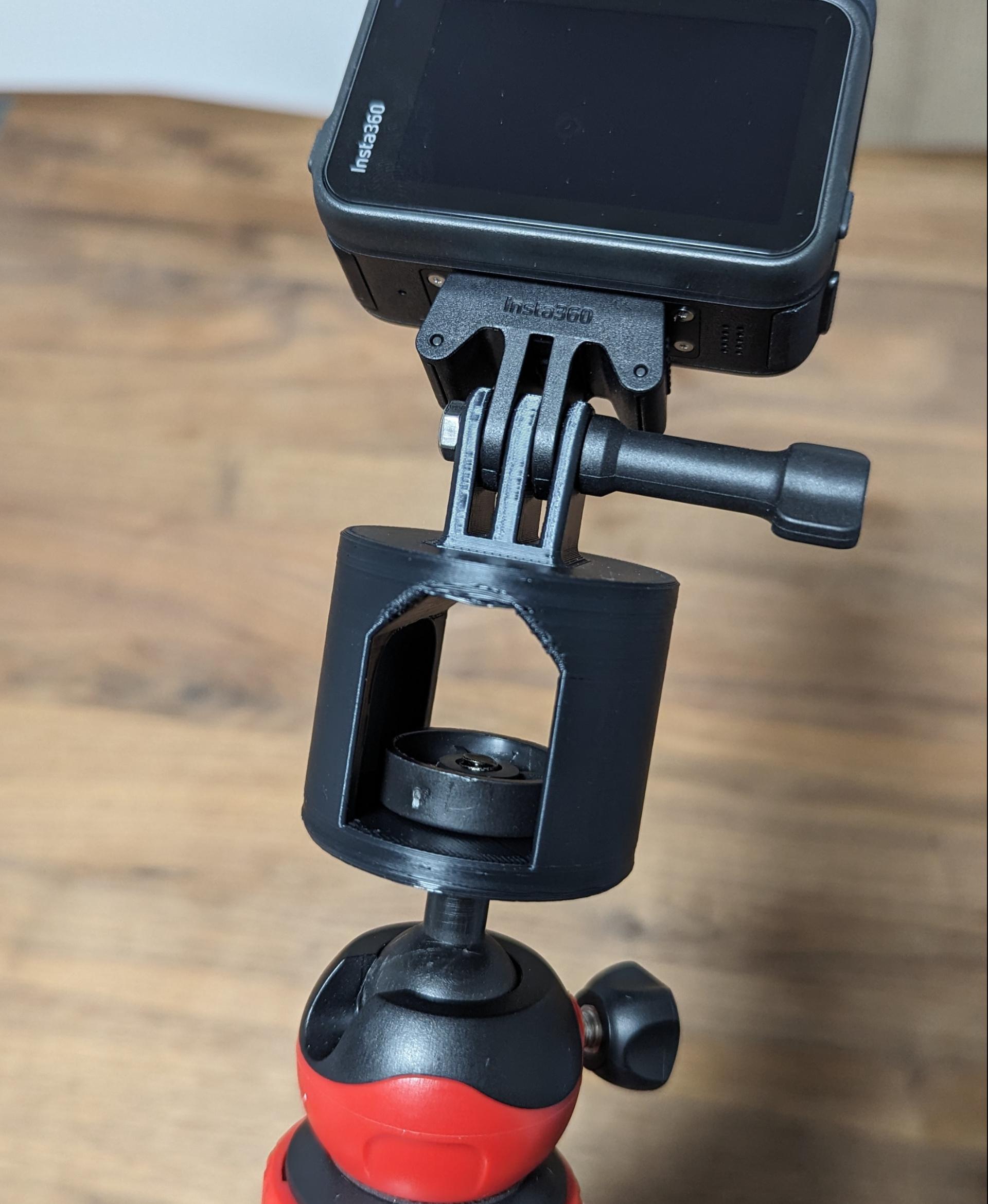 1/4" to Insta360 Mount - Mounted on a tripod using the included mounting disc upside-down instead of a 1/4" bolt.

This also uses the M5 x 0.8mm bolt that came with the official mount, along with an M5 nut that I purchased separately. The official mount and stand have an M5 nut that is glued in, so the nut cannot be used without breaking the included stand. - 3d model