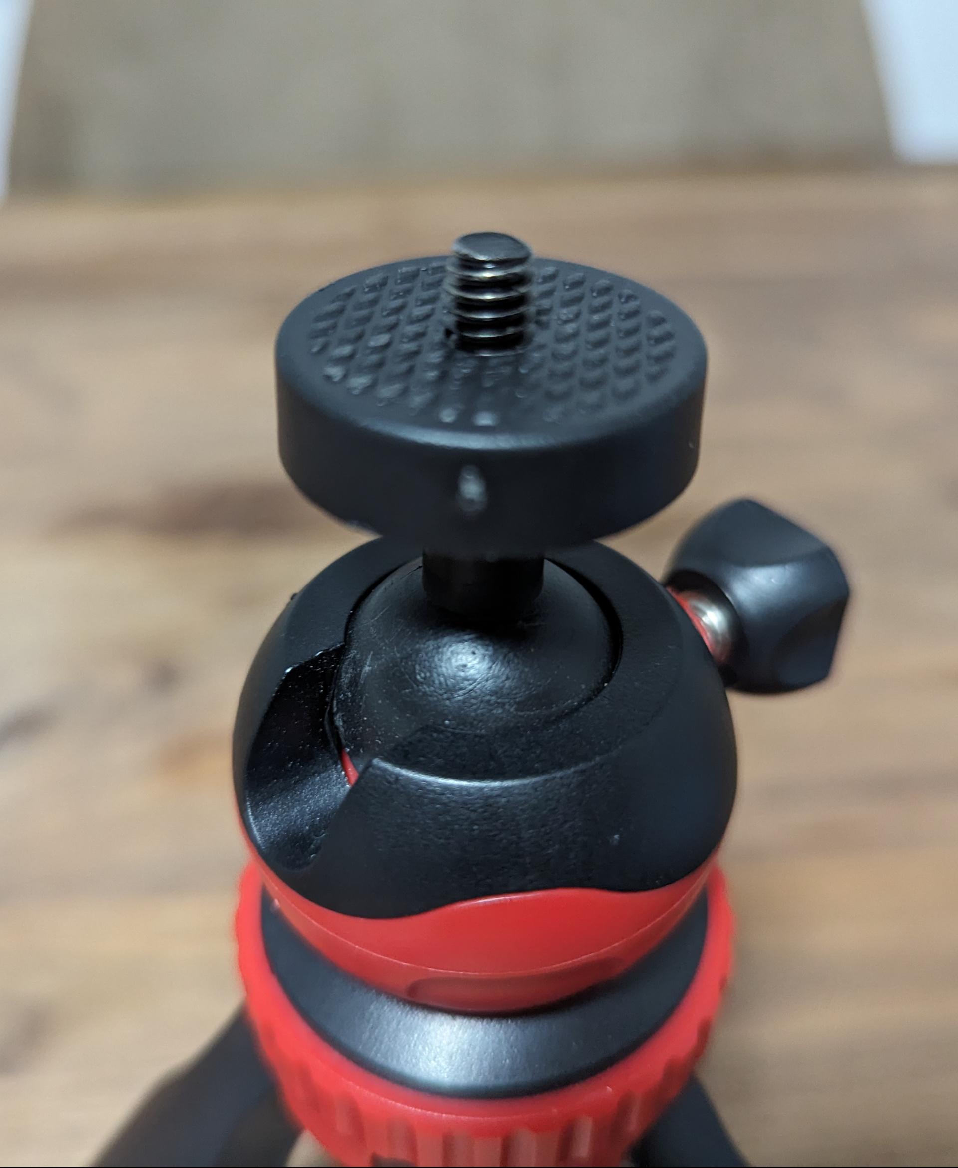 1/4" to Insta360 Mount - This is the tripod I attached my Ace Pro to, using this model. As you can see, it has a little plastic + rubber disc directly threaded onto the bolt. I removed this disc and turned it upside down to use it as a nut. This plate / disc / nut holds the printed model on the 1/4" bolt.

In my case, I also opted to add an M6 washer to the base of the bolt, underneath the printed model. I did this because the narrow ring of plastic surrounding the 1/4" bolt thread is a bit too narrow and cuts into the printed model a little. If you don't have so much thread exposed, or if you have a more substantial base for the model to be mounted on, you probably don't need a washer. I used M6, but naturally a 1/4" washer is probably more appropriate if you have one. - 3d model