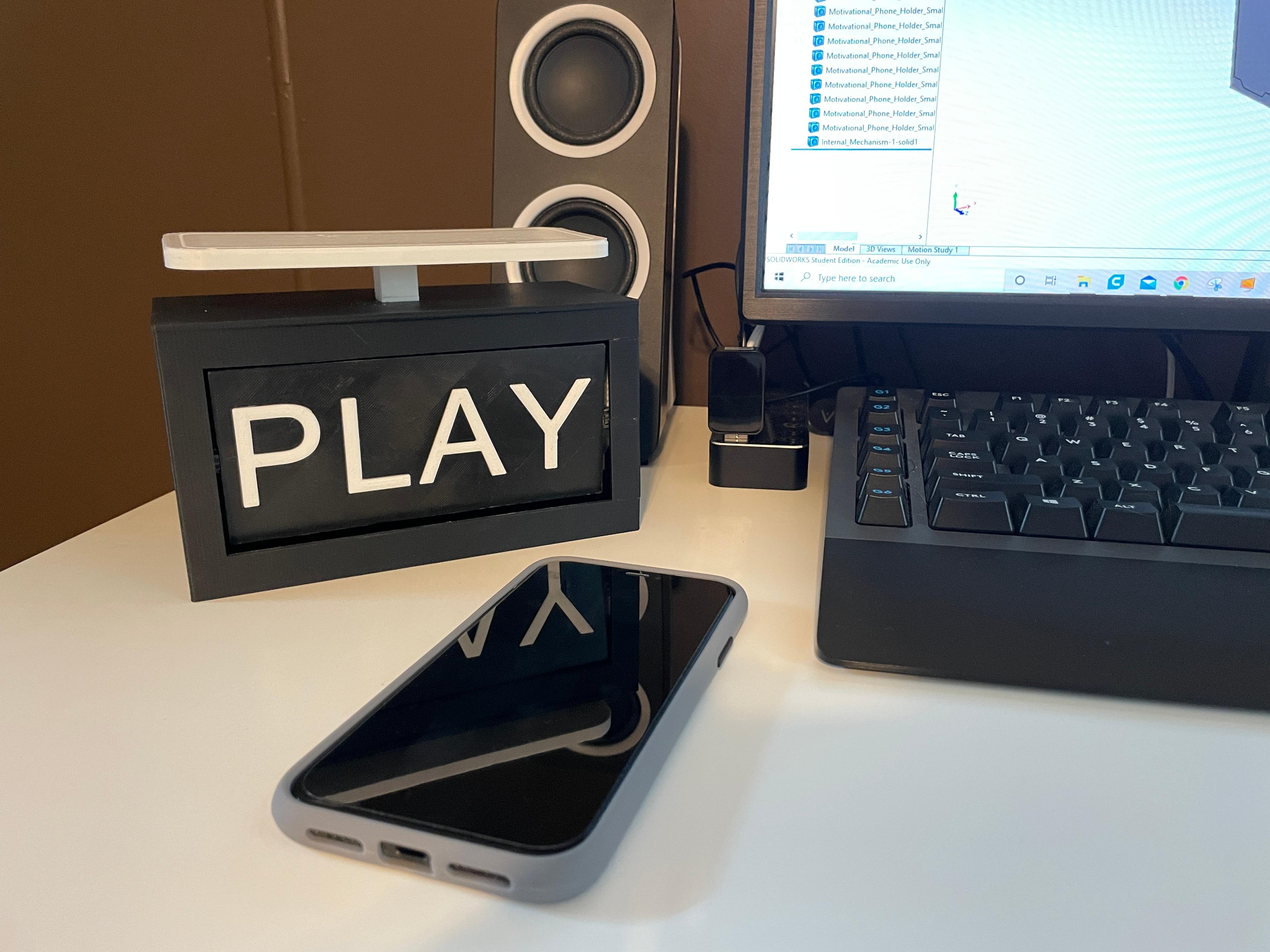 Motivational Phone Holder - Photo of it on a desk in action - 3d model