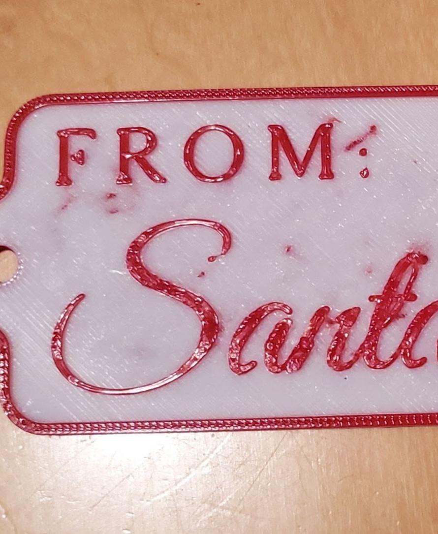 From Santa Tag.stl"From Santa" Gift Tag - Standard Bambu studio setting but with added ironing on top surface. didn't print very well please advise. 
Bambu P1S - 3d model