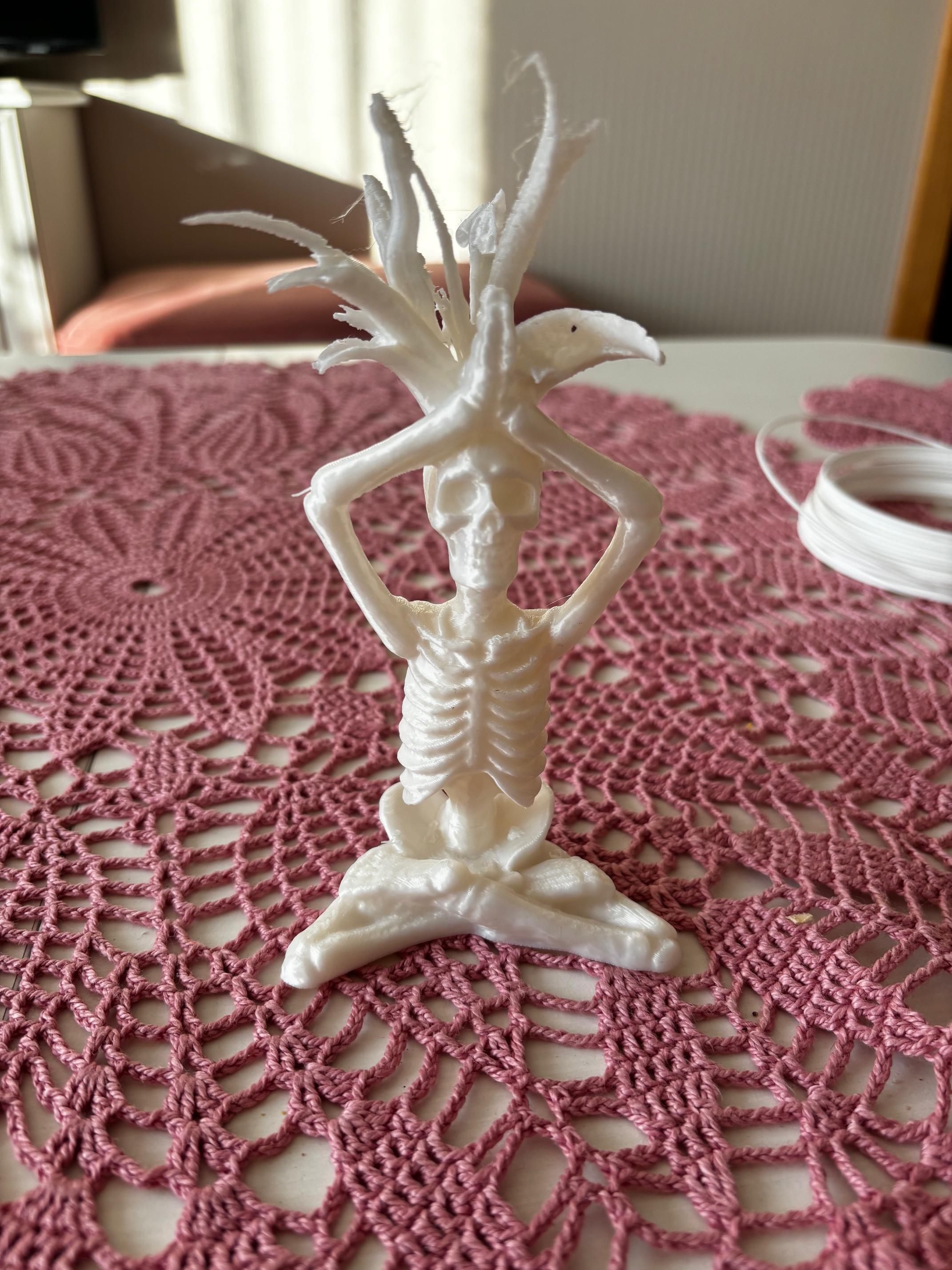 Skeleton doing yoga pose sculpture 3d model