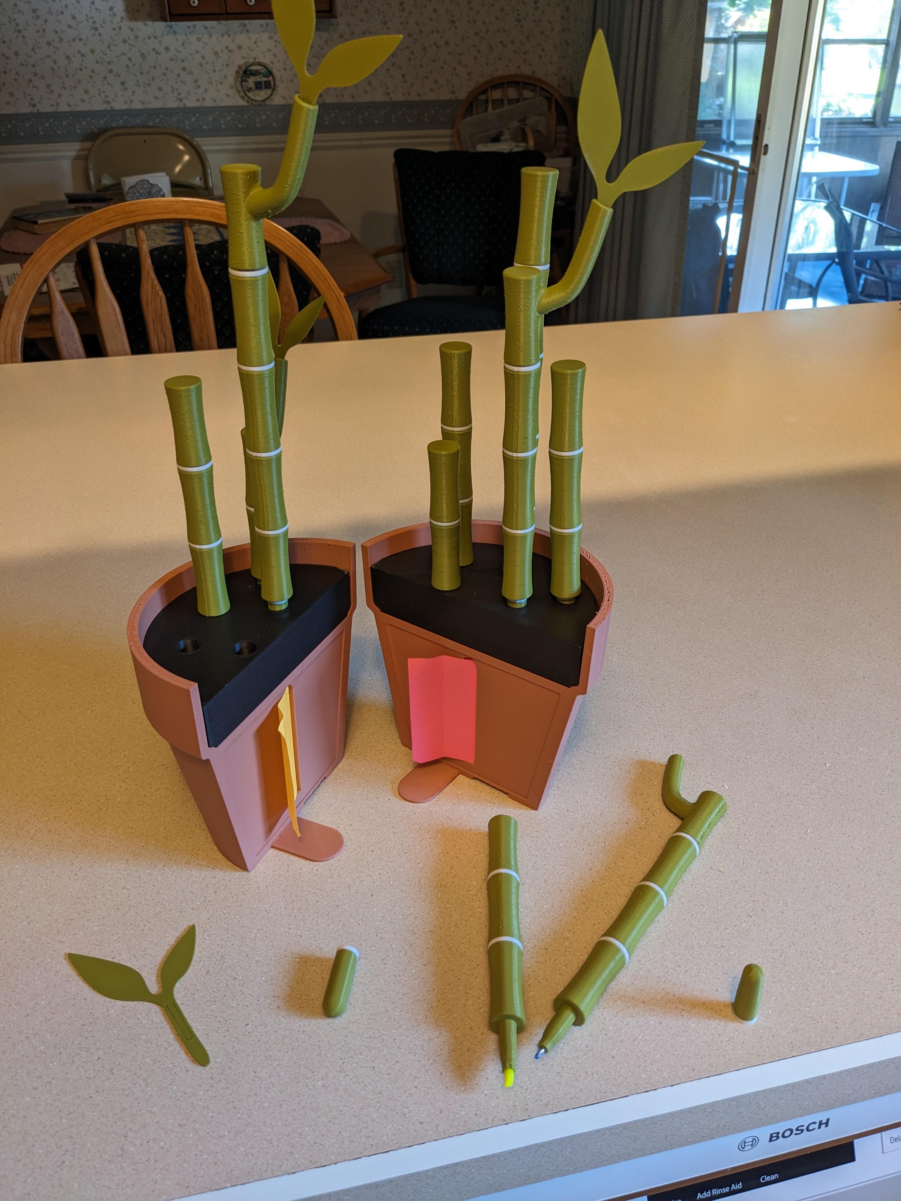 Bambookends - Bamboo Functional Plant with Pens, Highlighters, Post it note dispenser, and Bookmarks - Had to set my support angle to 75 to get Cura to generate supports only on the bottom of the pot. That's a pretty big stretch to go without supports but apparently everyone else does it no problem 🤷 Also I can't get over the irony of having to destroy 7 perfectly good highlighters to make 5 novelty ones, lol. Neat though innit!? - 3d model