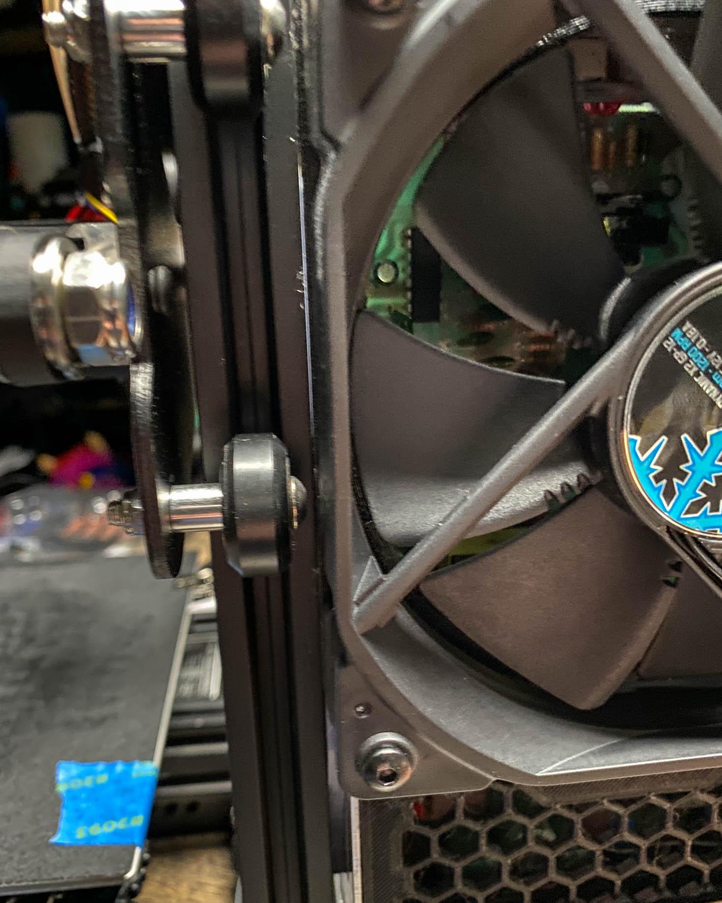 Ender 3 120mm PSU Mod Fan Cover with Buck Converter Mount - Spacer Installed between Z Axis extrusion and Power Supply to clear fan / rollers. - 3d model