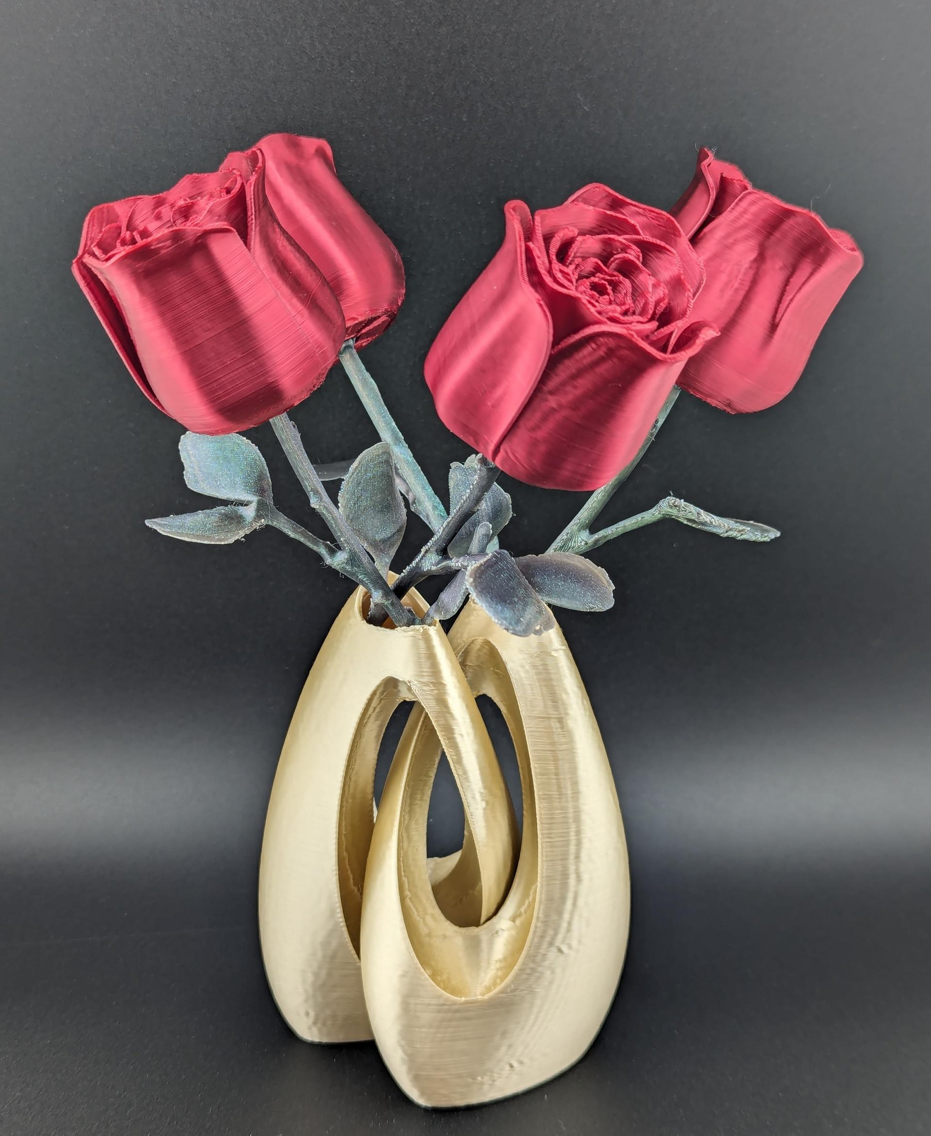 Rose - It took a little trial on the stem but the roses turnout amazing.  Also a little cheating with a drop of rose essential oil on each flower and I am about to go make my mothers day with a surprise gift.  

I just need to tell her these do not need water or sunlight!

The filament used was the polymaker 2023 Christmas pack.  It makes a wonderful combination.  - 3d model