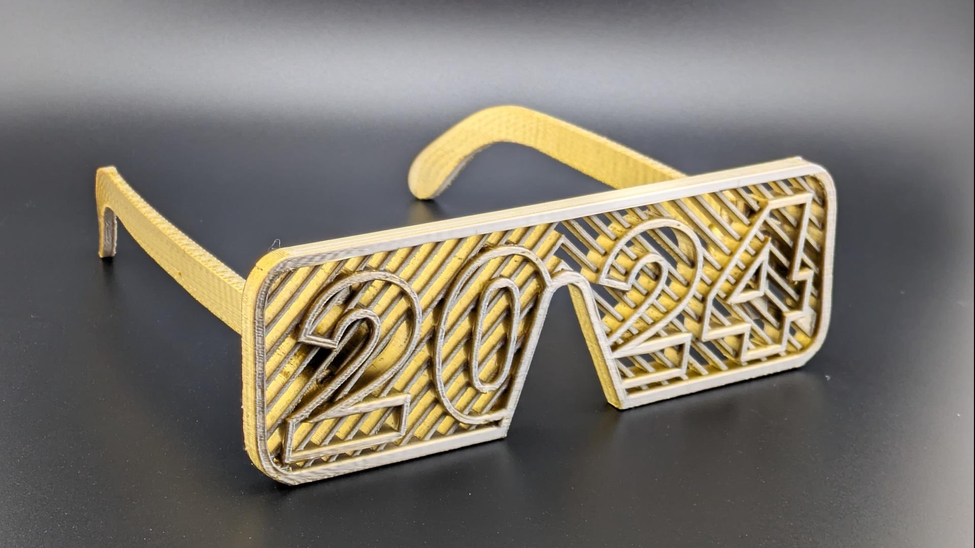2024 Glasses - 2024 Glasses printed in Silver Gold MatterHackers Quantum PLA 

(Printed On Ankermake M5C at .16mm layerheight) - 3d model