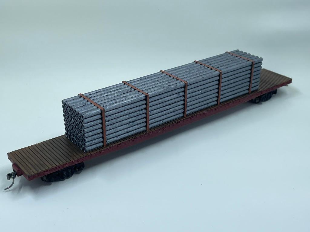 HO Scale 75ft Flatcar Freight Train car with a Pipe Load  3d model