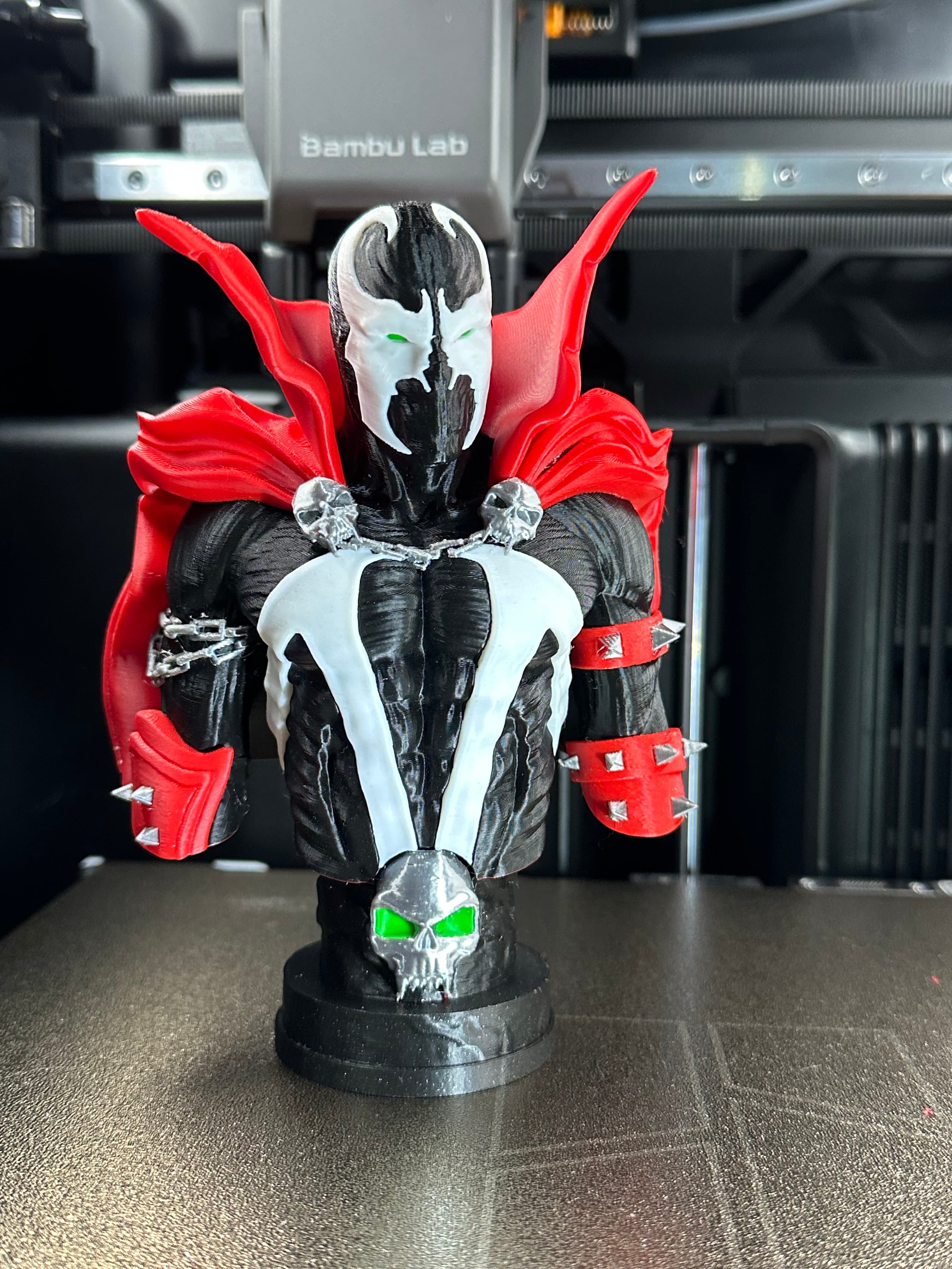 Printed on the H2C. The Bust is printed in 5 Colors of filament and 3 colors for the Base. The base main is Bambu Sparkle black.