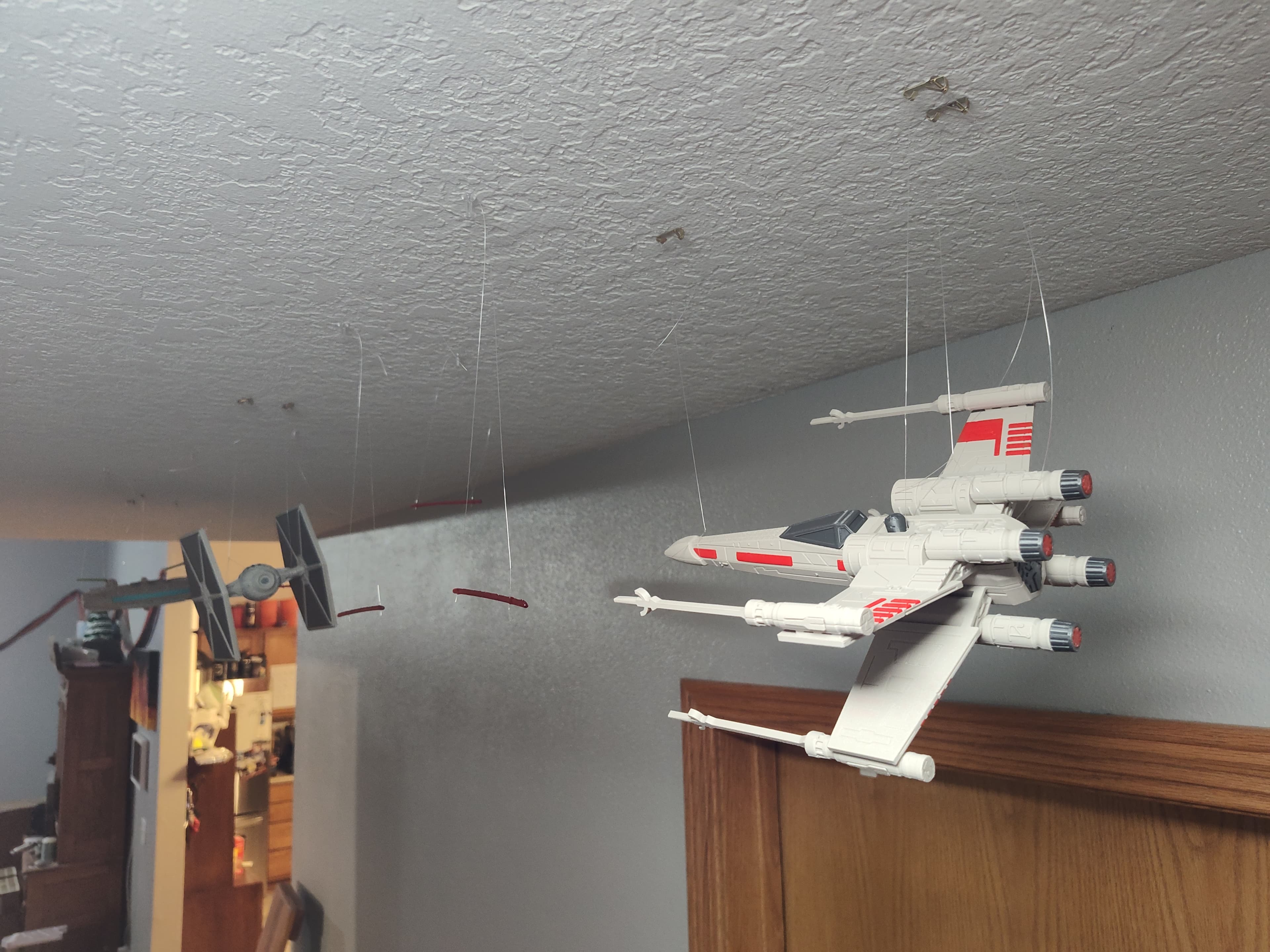 Epic space battle down our hallway between the X Wing, Tie Fighter, and the Millennium Falcon!