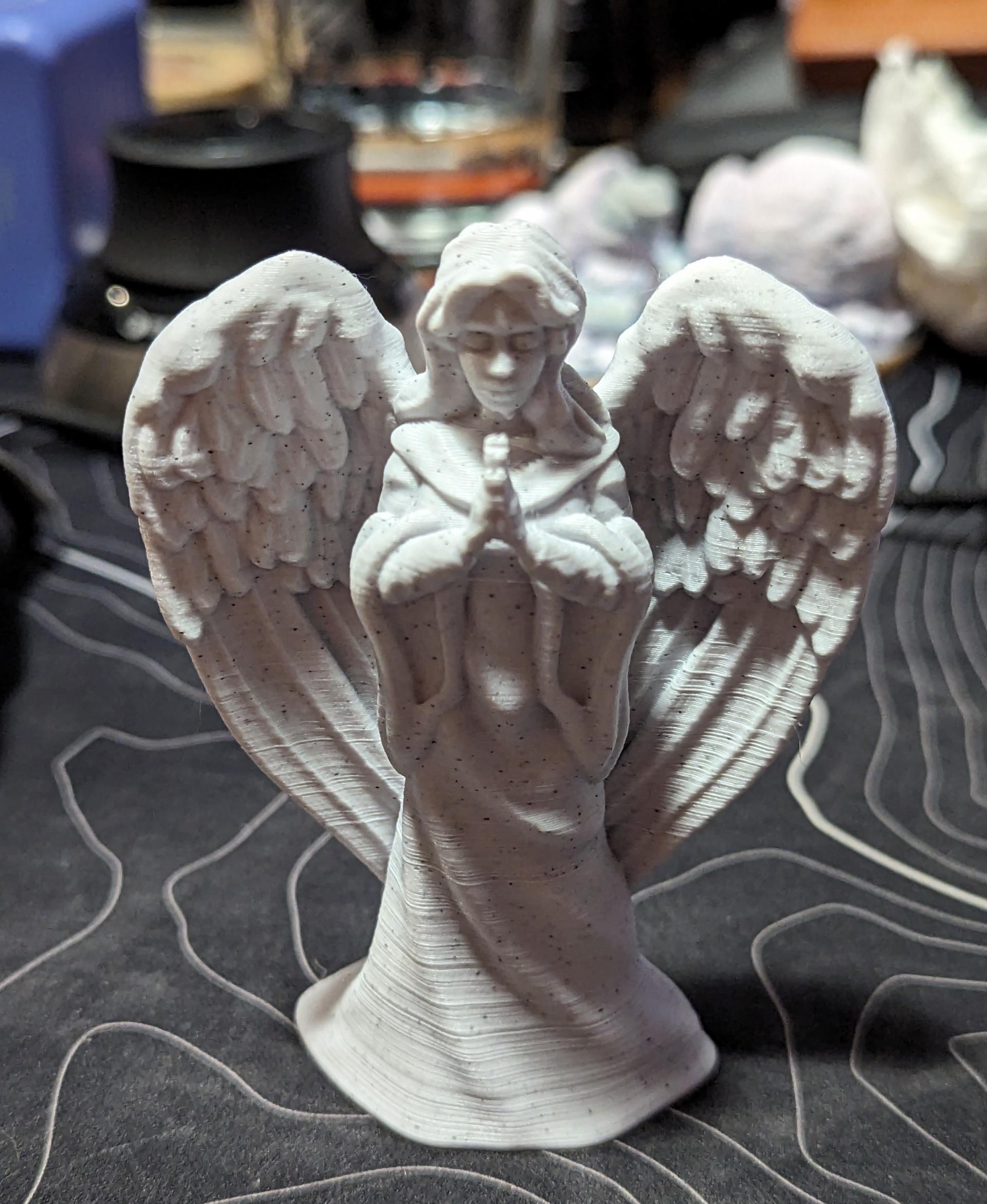 Christmas Angel - A little half scale angel from Polymaker Marble PLA.

I enabled the ‘Make overhangs printable’ option to print this with no supports.  It’s only a little noticeable to help the chin print without supports. - 3d model