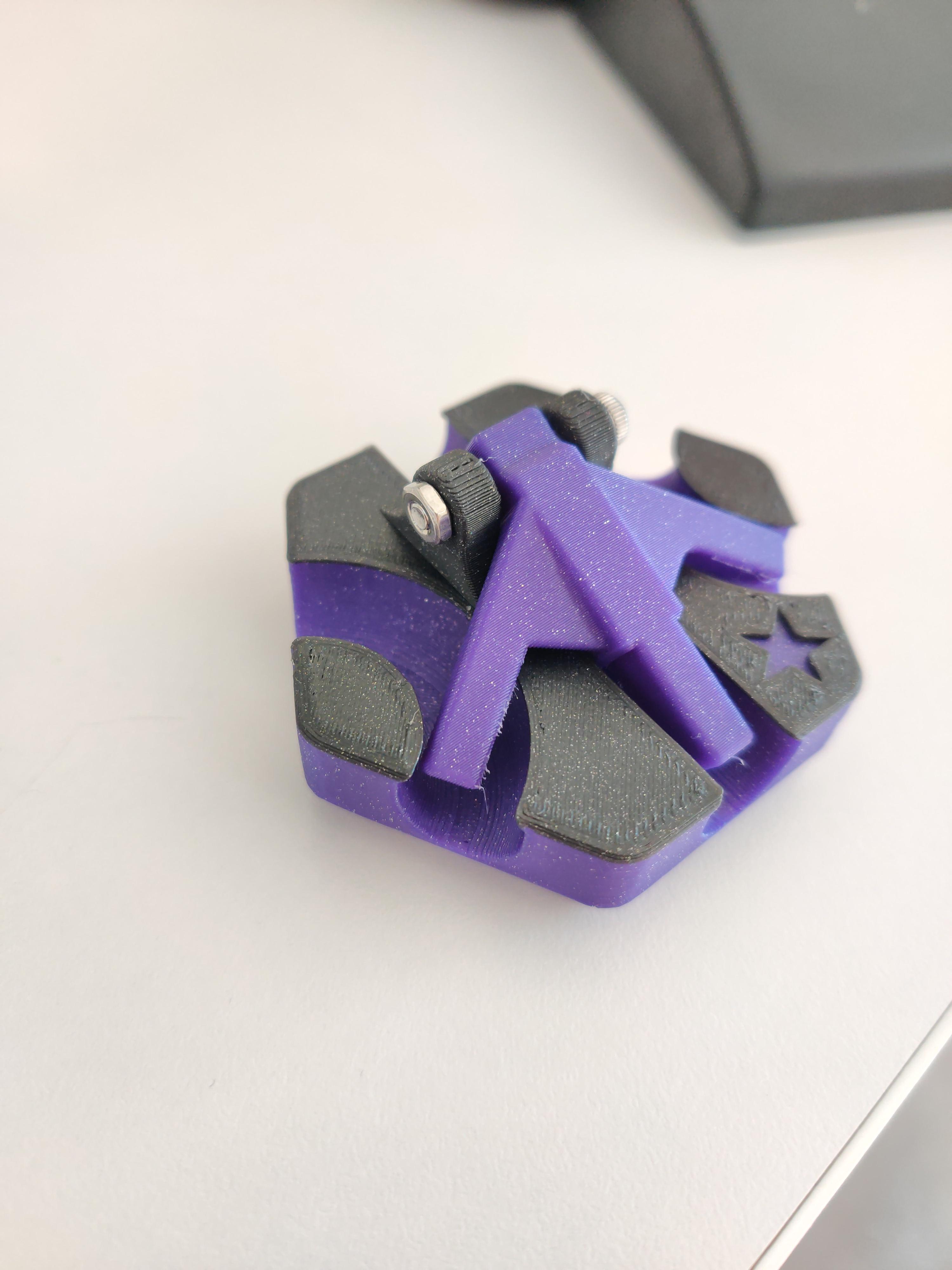 Catch Tile - Printed using Ionized Cobalt Black and Geomagnetic Mauve Fusion Filaments ABS 1.5. Arm is held in place using an M3x20 screw and a hex nut. - 3d model