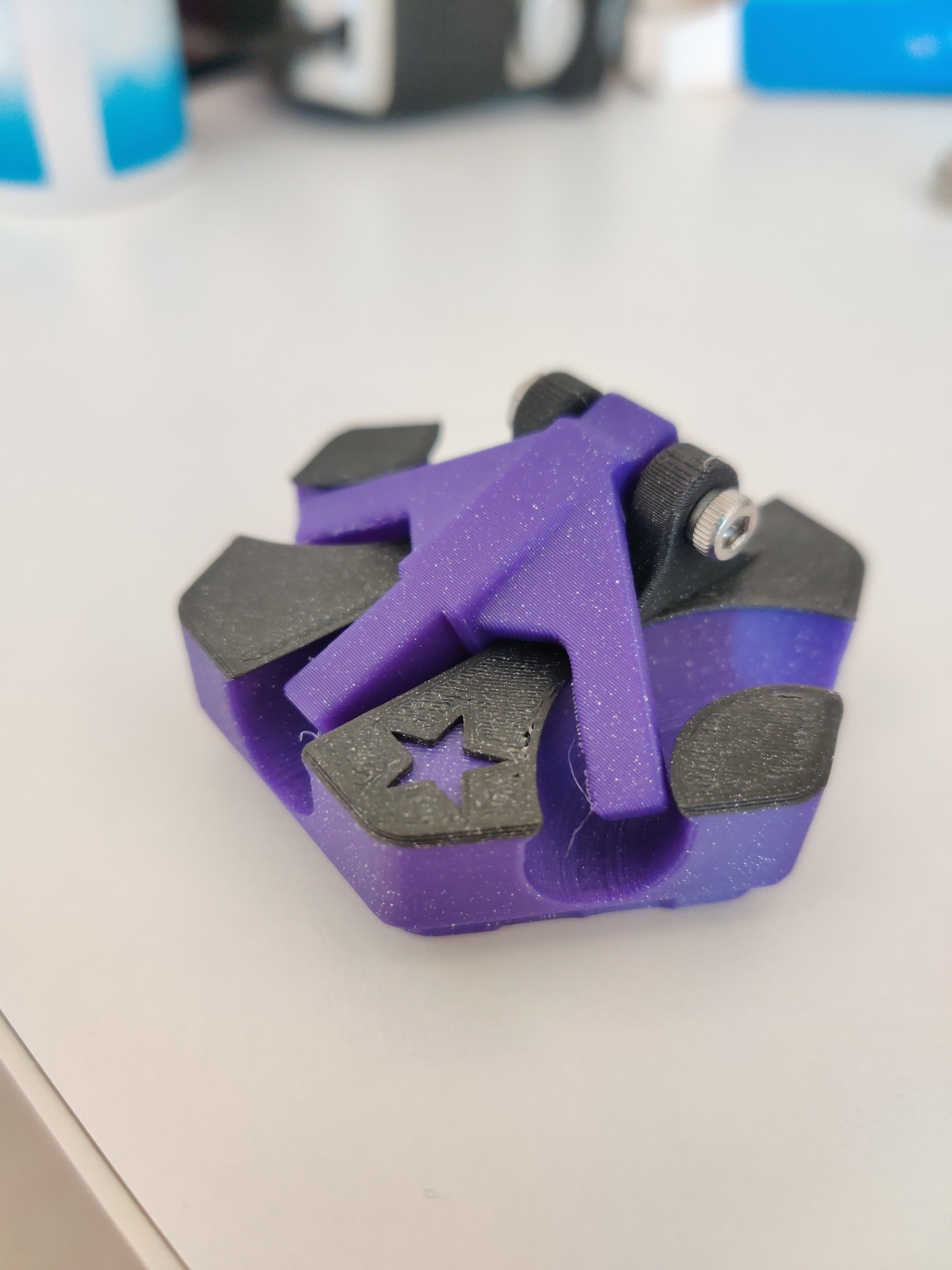 Printed in Geomagnetic Mauve and Ionized Cobalt Black Fusion Filaments ABS 1.5. Uses an M3x20 screw and a hex nut to hold the arm in place.