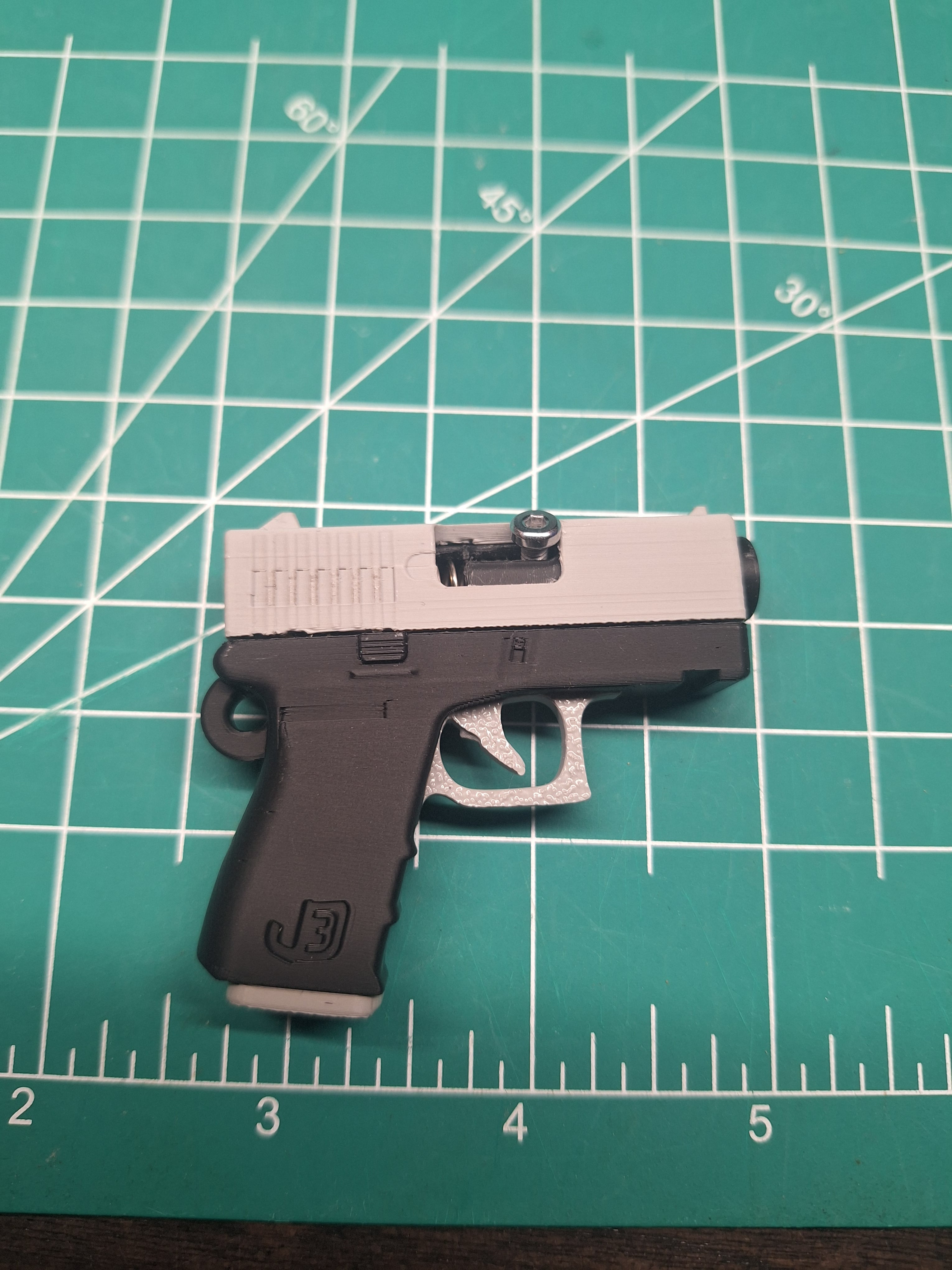 Really enjoy this model. I found the mag doesn't stay in for me. I'll add a drop of glue on the inside of the magwell to make it tight or some tape. I also could not get the screw to stay in the primed position at first but figured out if it set the screw deep enough so the head is almost flush to the slide it pushed it back enough so that it works perfectly every time. I added some Pics to hopefully explain it better.
Also, I'm sure it can be done in the slicer but I'm new and didn't attempt to but I drilled a hole in the mag to fit 2 extra bbs as storage. Lol really a fun little toy to bother my friends with. 5 stars š for me. And will definitely look at the other models.