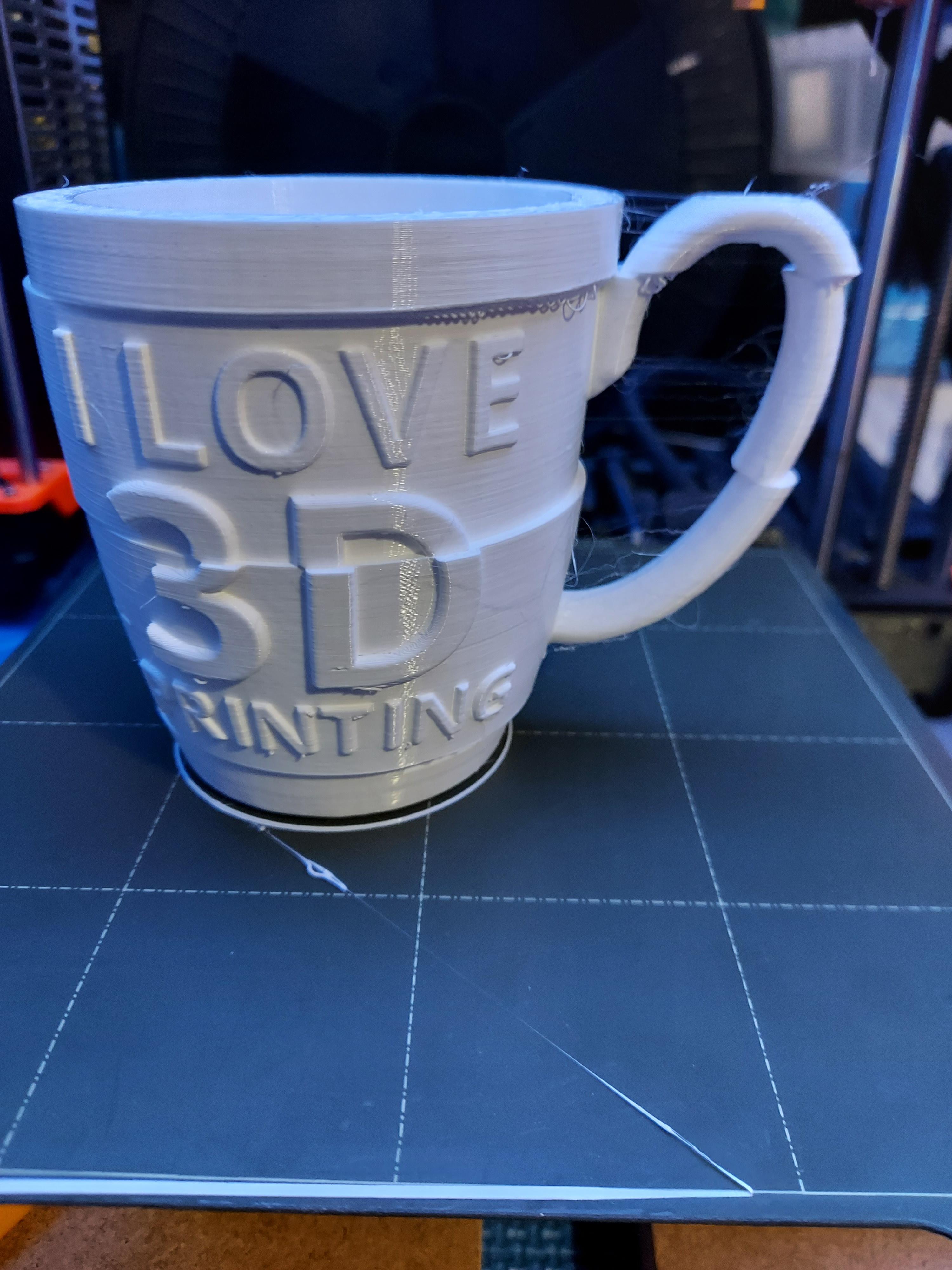 I Love 3D Printing Gag Gift Mug - My printer/filament decided it needed some stringing for extra authenticity as well. 

I have a near 100% failure record with white filament (just white!), ironically the mug finished without any other issue than the stringing (filament's been open for a year or two). - 3d model