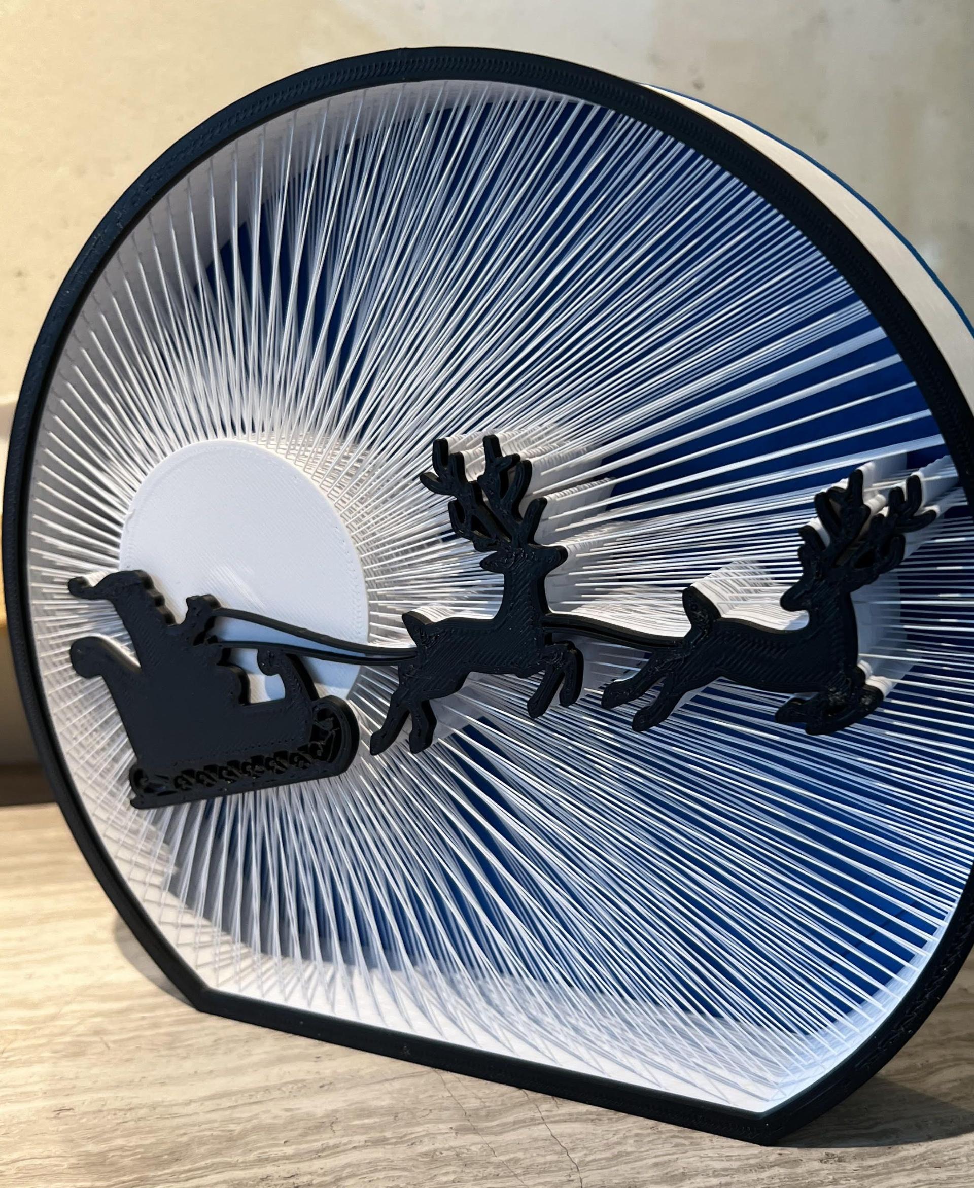 Moonlight Santa String Art - Wow!  I have no idea how this was designed, but it printed perfectly on my first try (with eSun ABS+).

Just amazing - 3d model