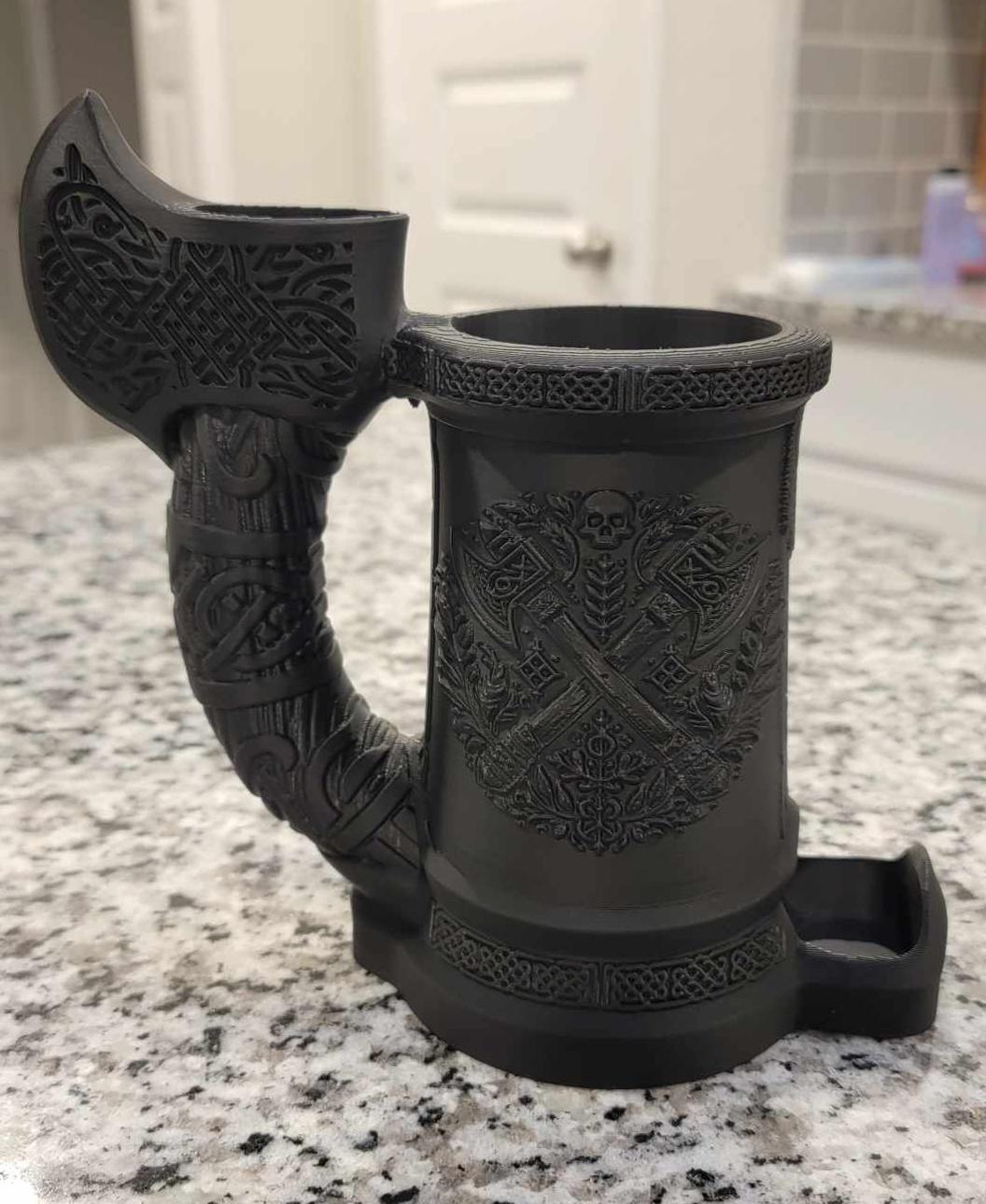 AX Handle Dice Tower can Cozy - These are so frickin' cool! I printed the Dwarven Axe one last night at .2mm layer height with 20% infill and no supports. There is some slight sagging on the underside of the axe handle and between where the axe meets the lip of the cup. I'm going to print it again with variable layer height and supports on critical regions only to see how it turns out.

I would love to see a Druidic/Nature one in the future if you're open to suggestions, like a tree stump covered in mushrooms. - 3d model