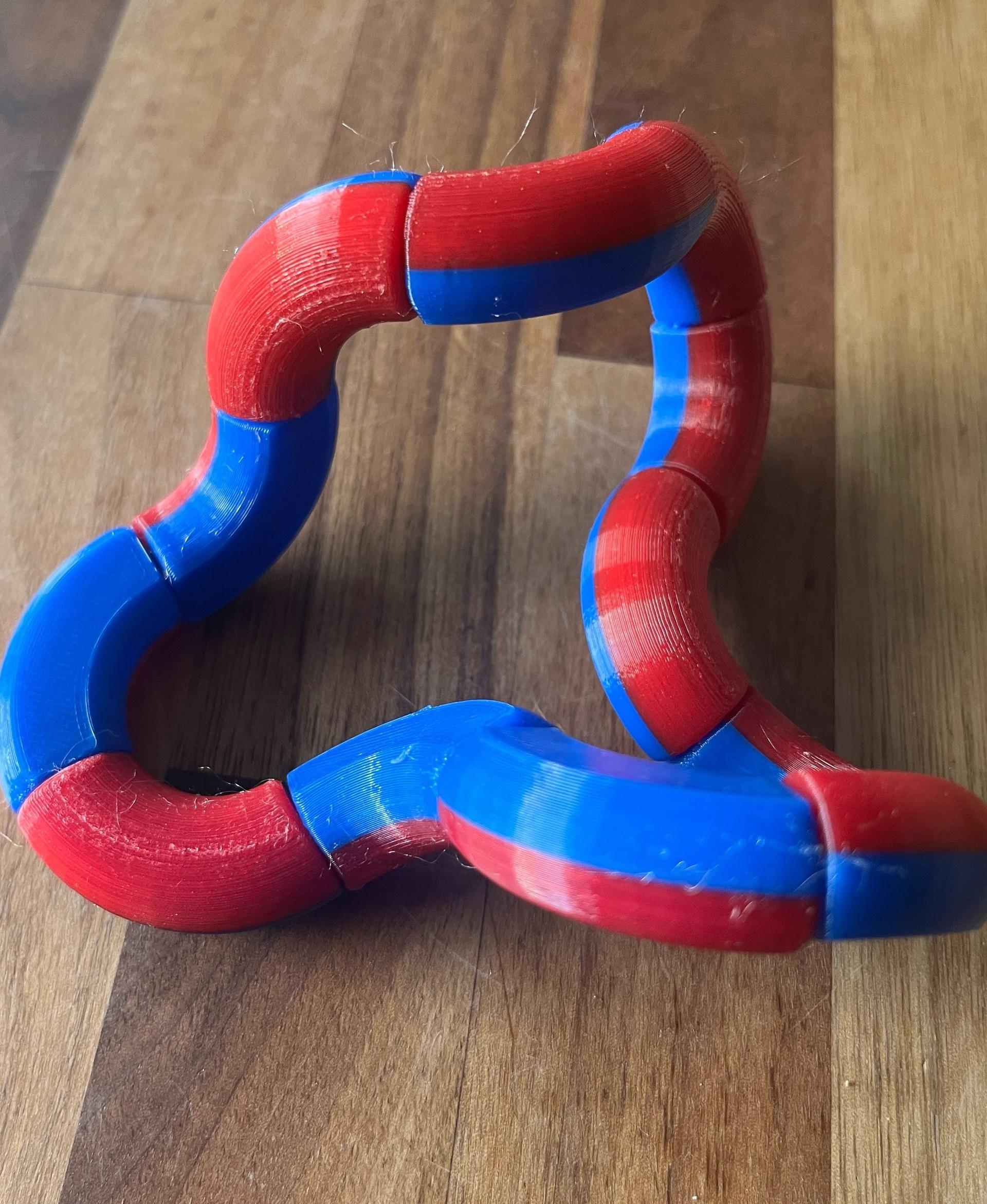 Dual Colour Twisty Tubes - Fun model to play with. To assemble the layered version in PrusaSlicer, need to add the bottom part, then right click on it and add the second part to it for it to model correctly. My first attempt was a failure and didn't hold together. - 3d model