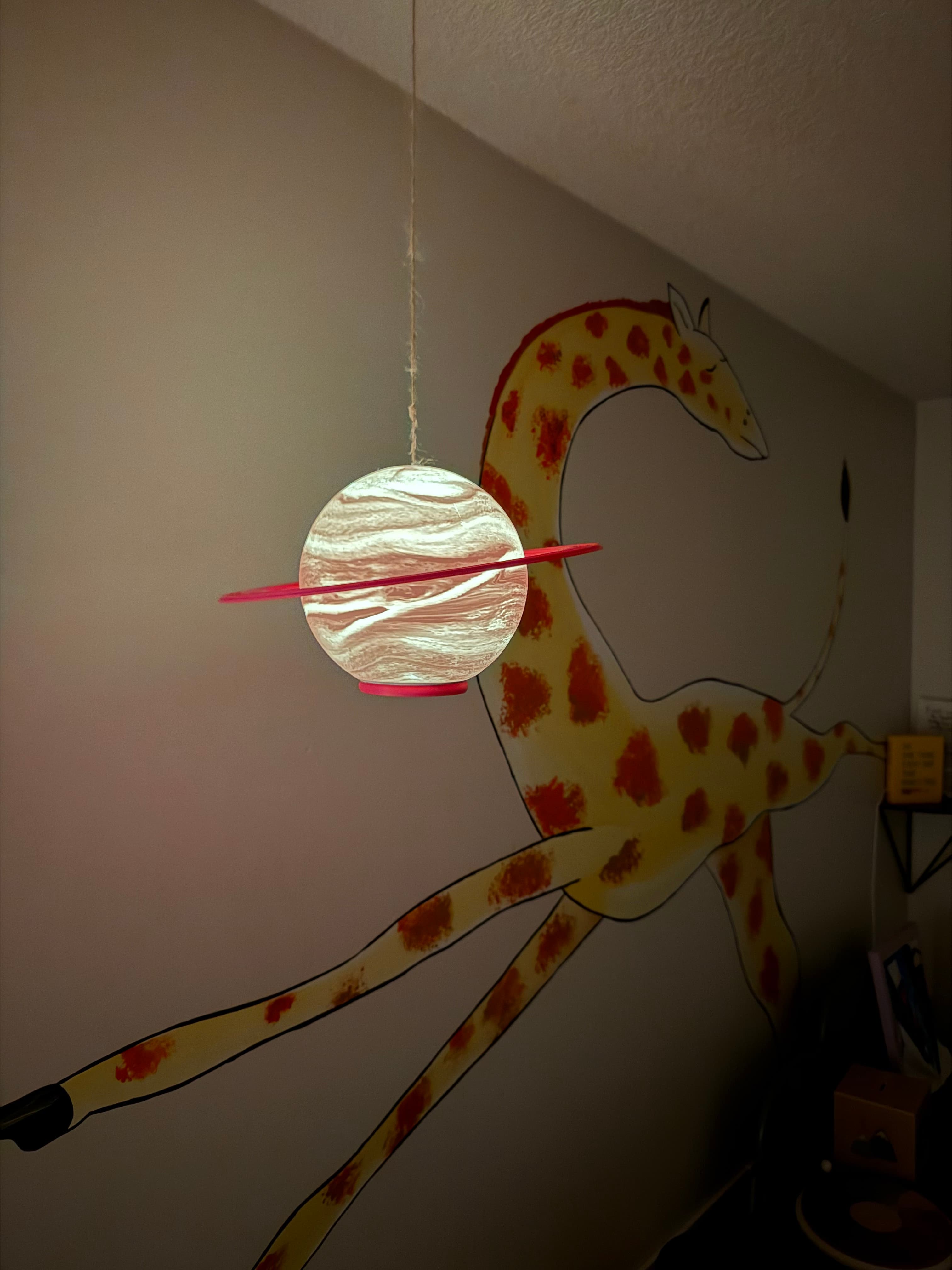 Made some minor edits! Made slightly more space in the base to hold a battery powered puck light, then added a small hole in the top to attach some twine. Now my kids have a hanging, color changing, remote controlled Saturn right in their bedroom! VERY cool and they are already requesting more planets...