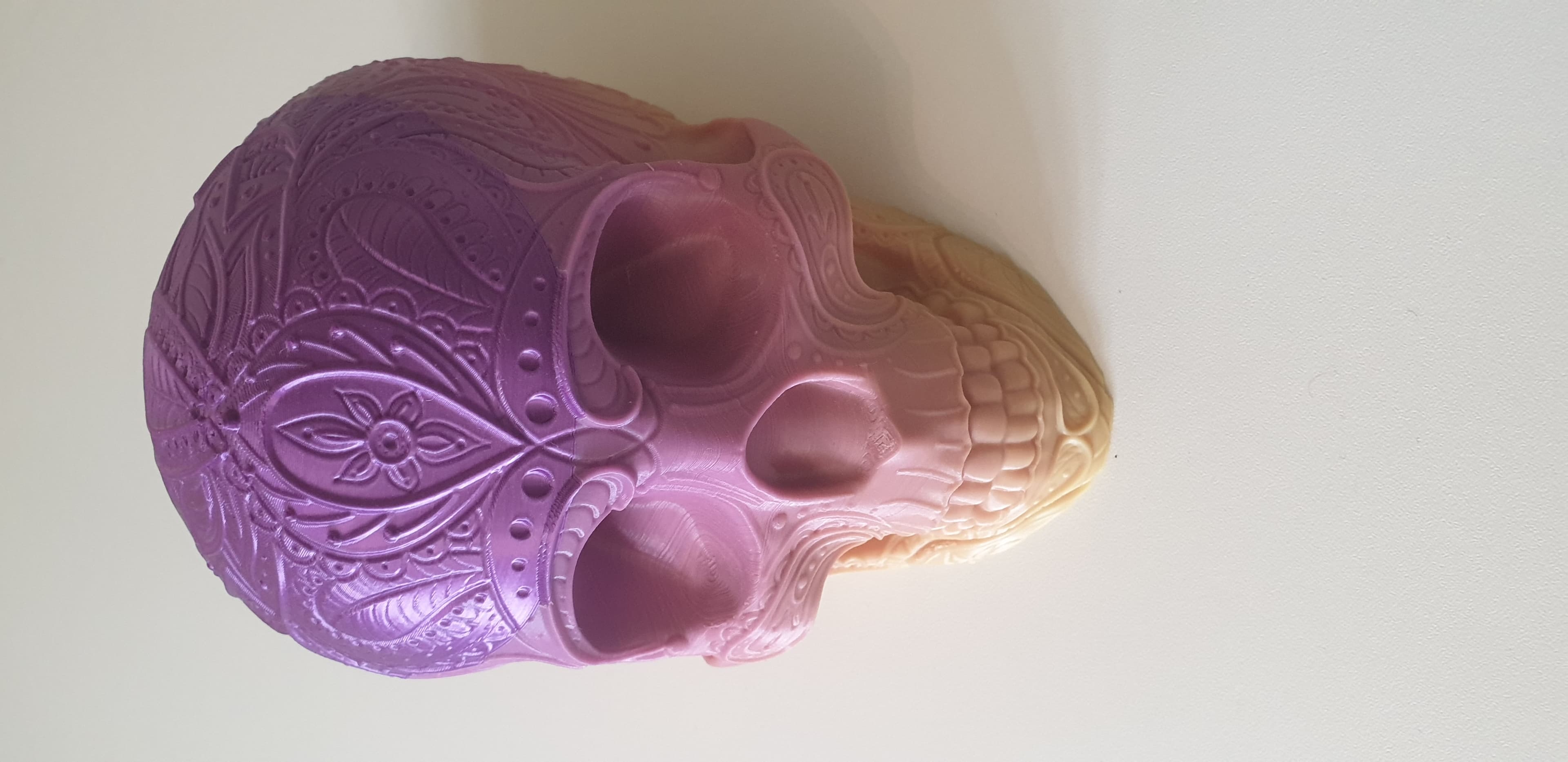 Paisley Skull
0.16 Layer Height
15% infill (forgot to change to 5% before slicing) so had to change out of filament through print.
Bottom 2/3rds of print is in Xvico rainbow PLA, final 3rd in Eryone Silk Purple
Supports under cheek bones.