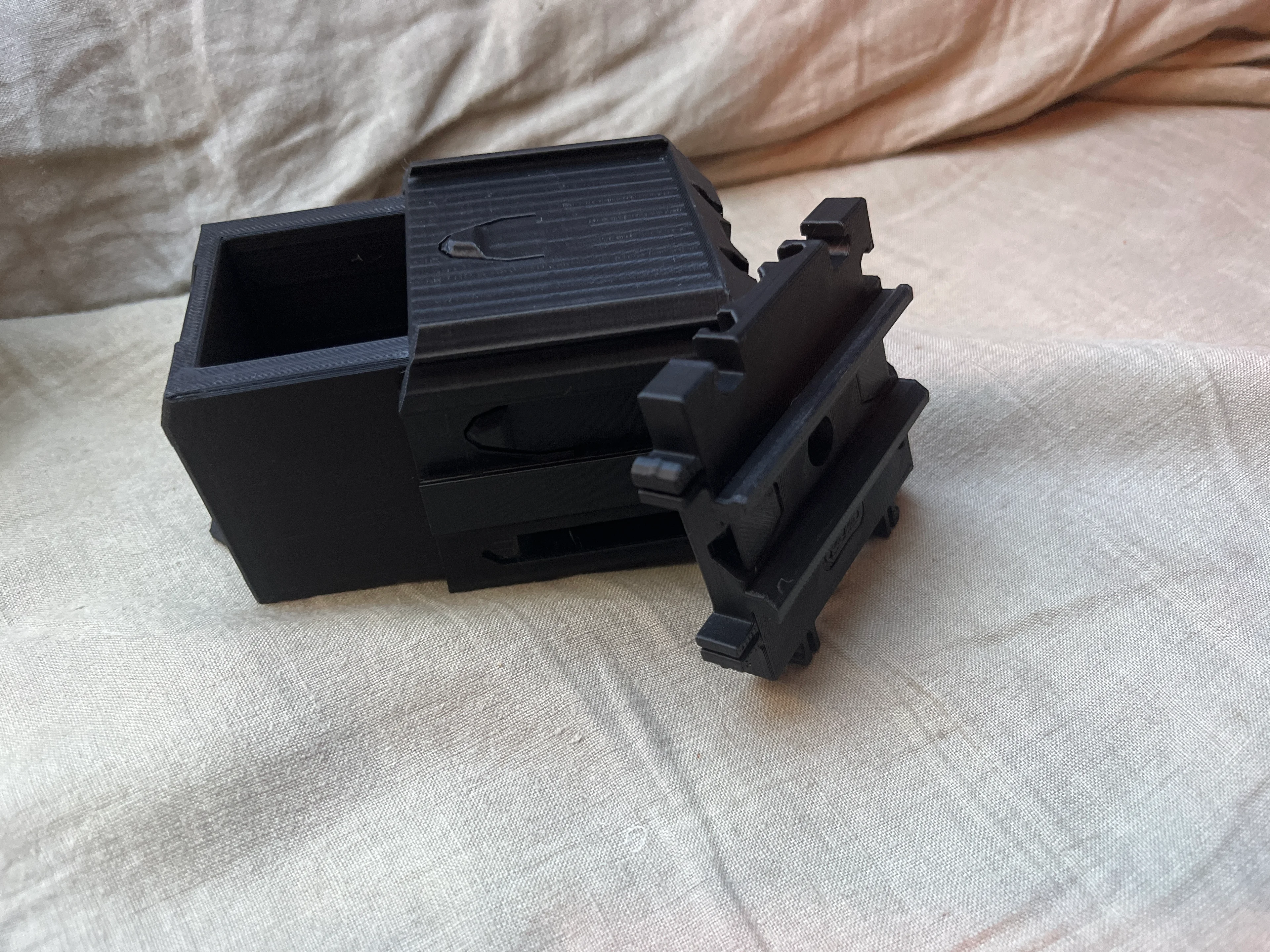 Printed this last night but it came out nothing like yours, the rail stoppers wont click up and the storage slot wont flop down like yours do
