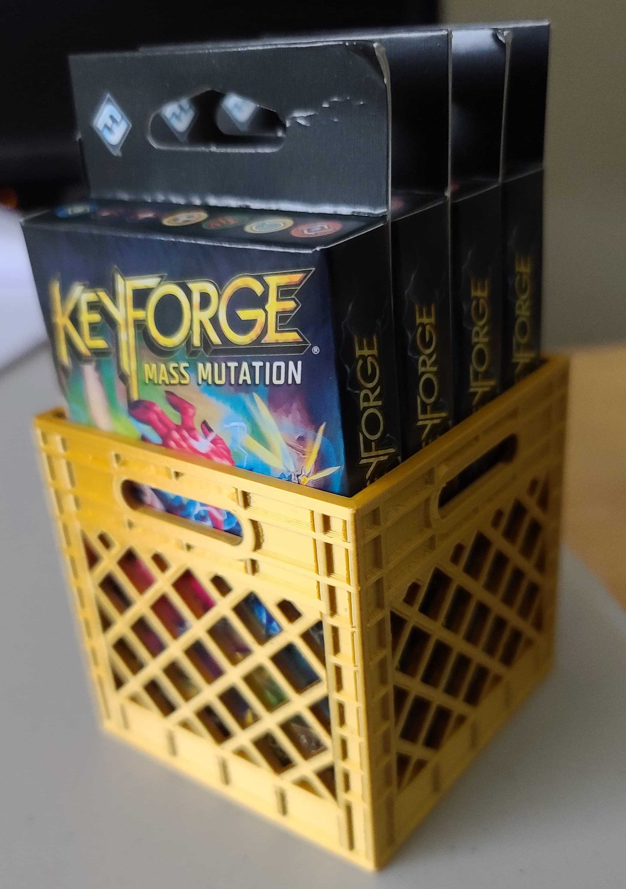 The medium sized crate is 4 keyforge decks big, exactly.