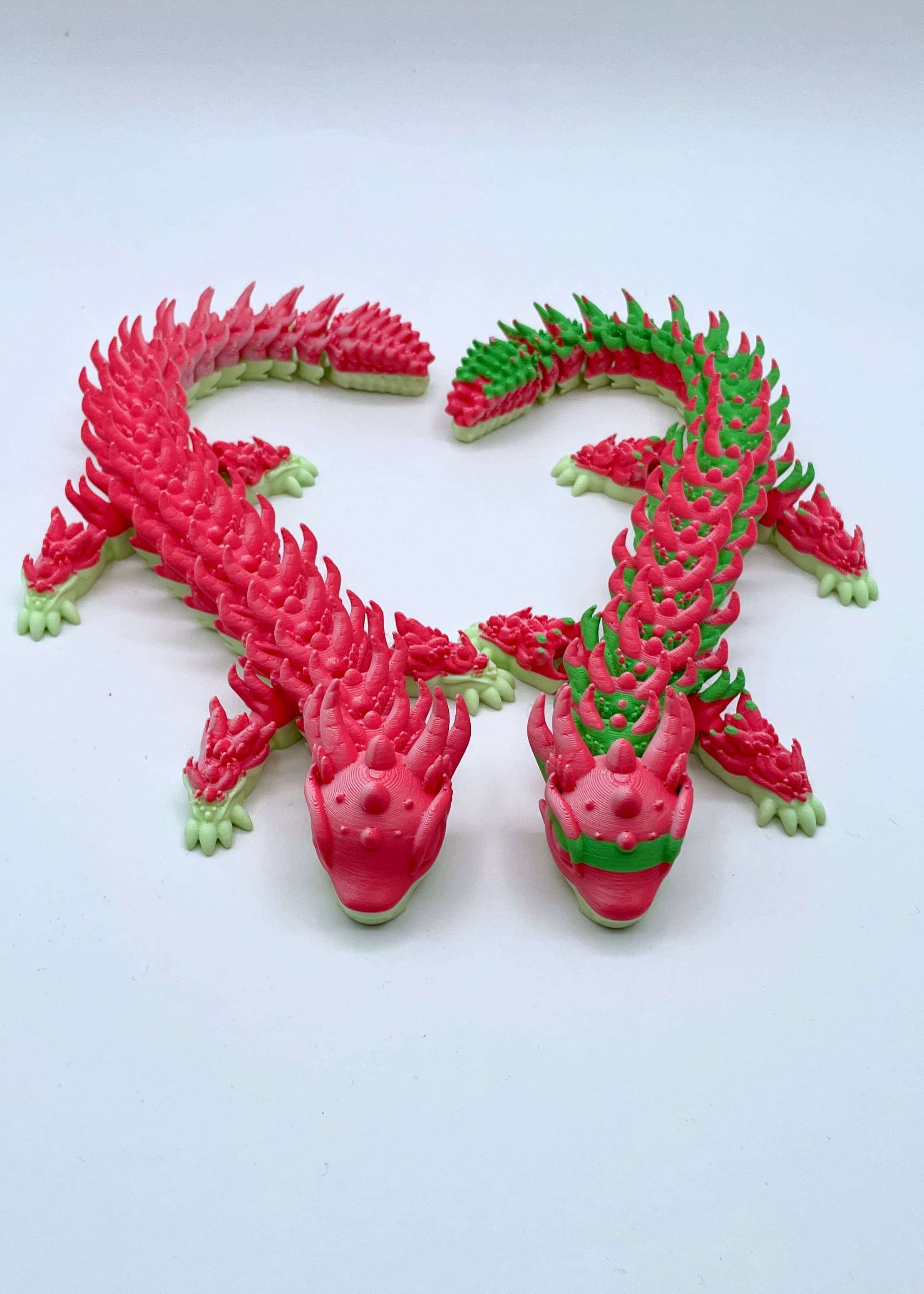 Articulated Dragon - So fun! I used Polymaker Panchroma Dual Pink/Red "Flamingo," Pastel Mint, and Green! - 3d model