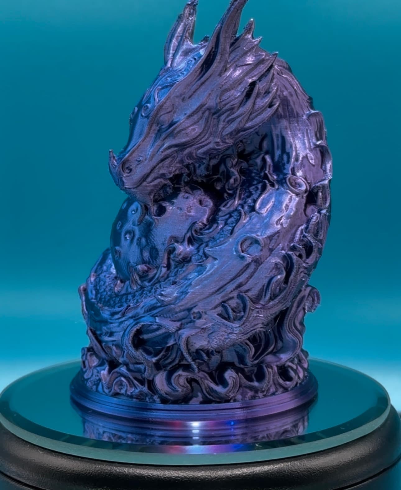 Experimenting w/a filament I received a dual extrusion tricolor silk blue purple black. Printed at 50% scale at .08 layer height.
