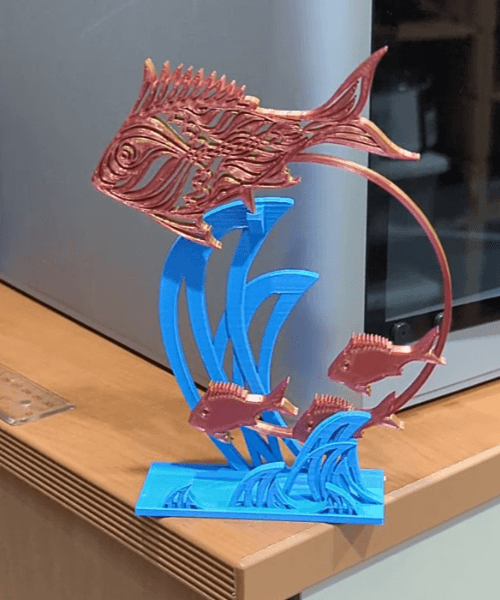 Swimming Fishies Fidget Desk Toy - A layer adhesion issue caused a wave to break off on the left side, but it still looks and works great! - 3d model