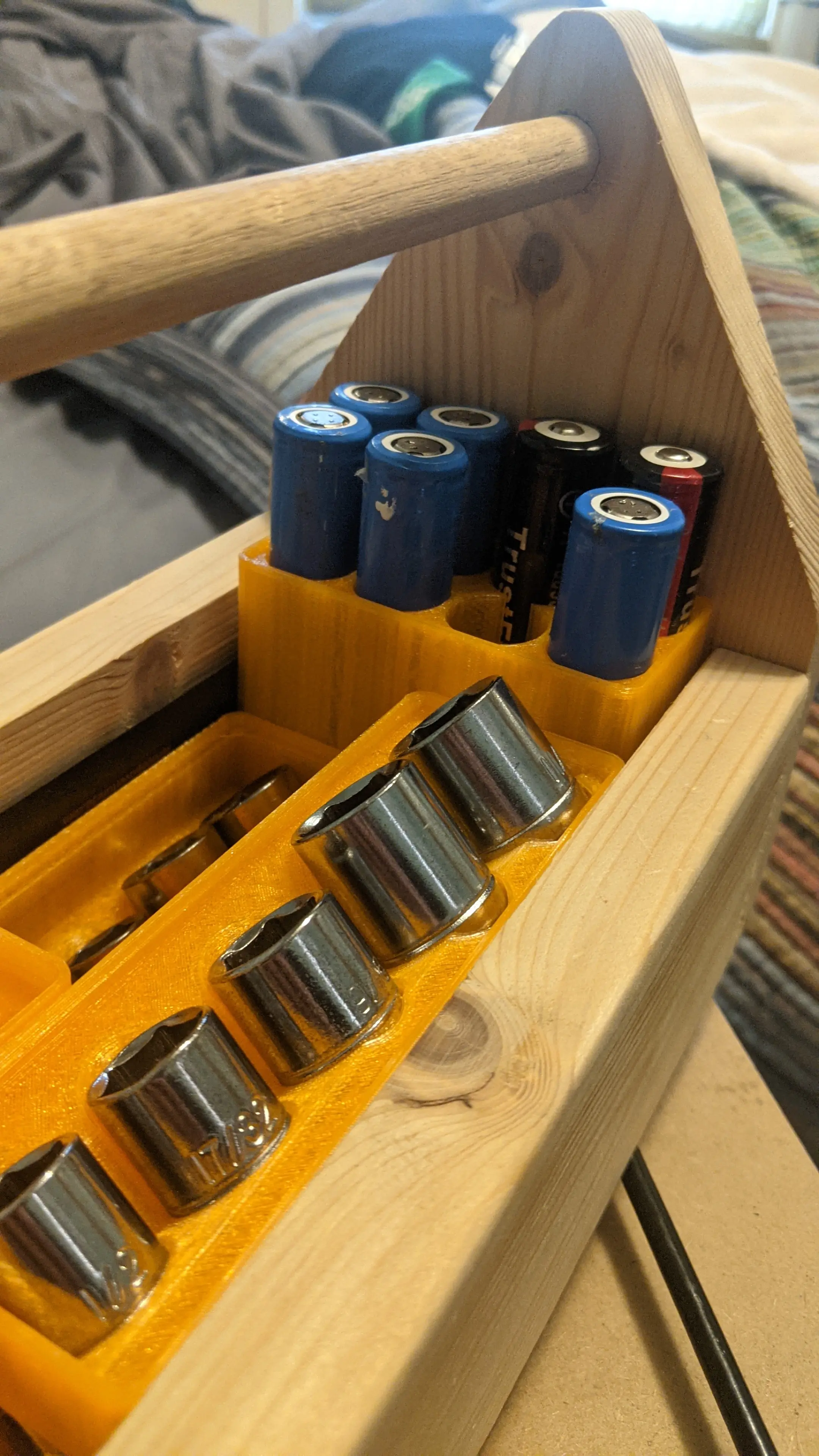 Some of my batteries are taller than the others. (also seen are my socket holders from https://github.com/vector76/gridfinity_openscad/pull/5)