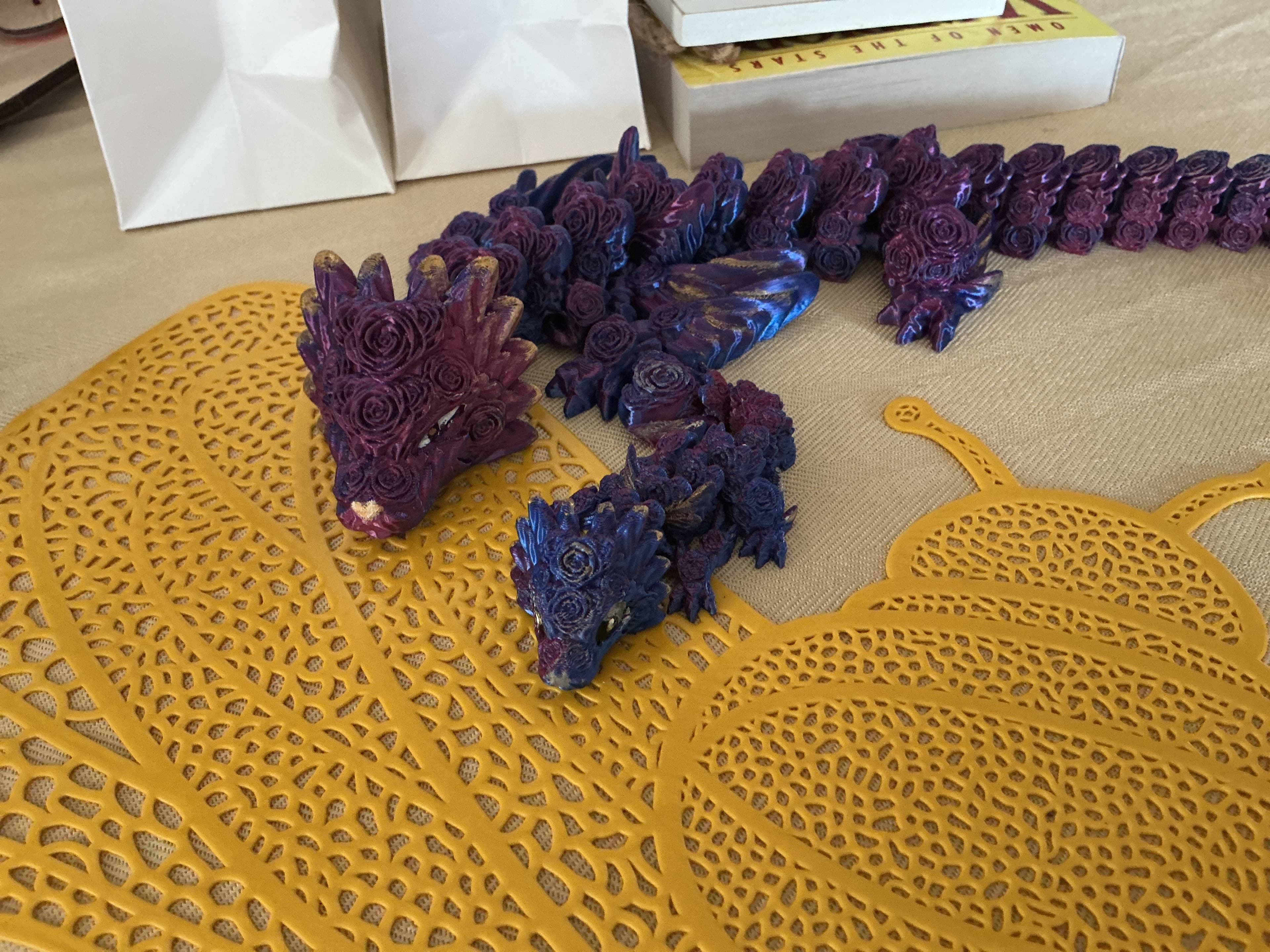 Cute little baby I printed with blue and pink PLA silk.
She turned out gorgeous, I painted her to match the adult rose dragon.
Thanks, CinderWing!
(Sorry if I’m not allowed to post both dragons together.)