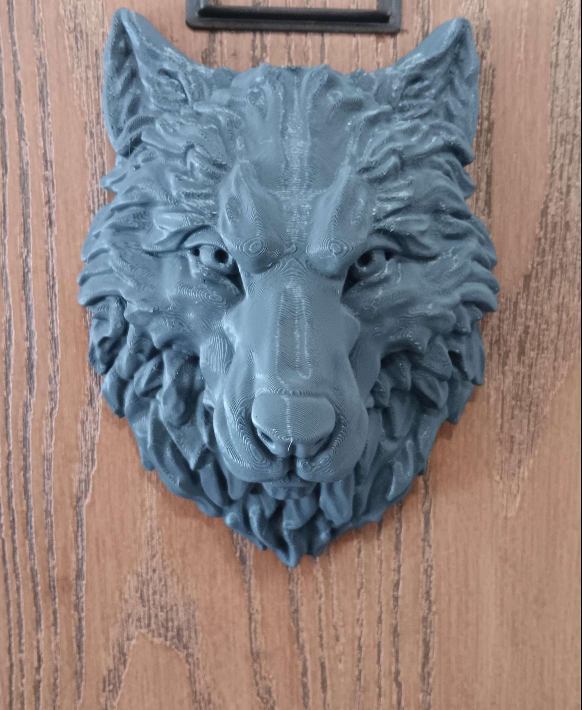 Wolf - Wall Decoration - Printed in Sliceworx Engineers Gray. I put it on my apartment door. No amazon can put my orders in the right spot lol.
 - 3d model