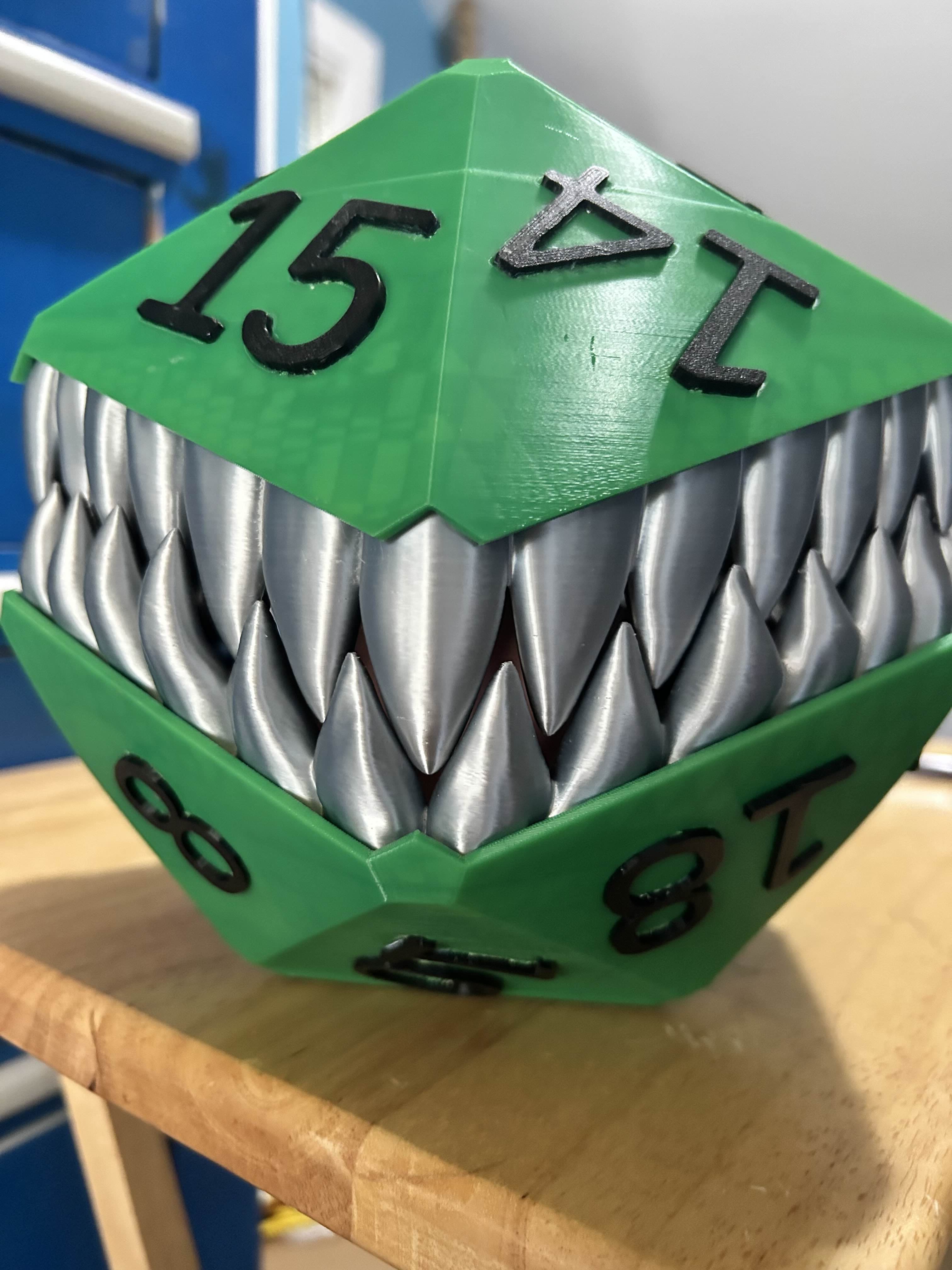 Brim was required on the central tower and the tongue. I do recommend using supports on the body, if you're not going to use the pre-printed numbers and plan on painting the insets. Supports are not necessarily required on the inside top and bottom, but it wouldn't hurt.